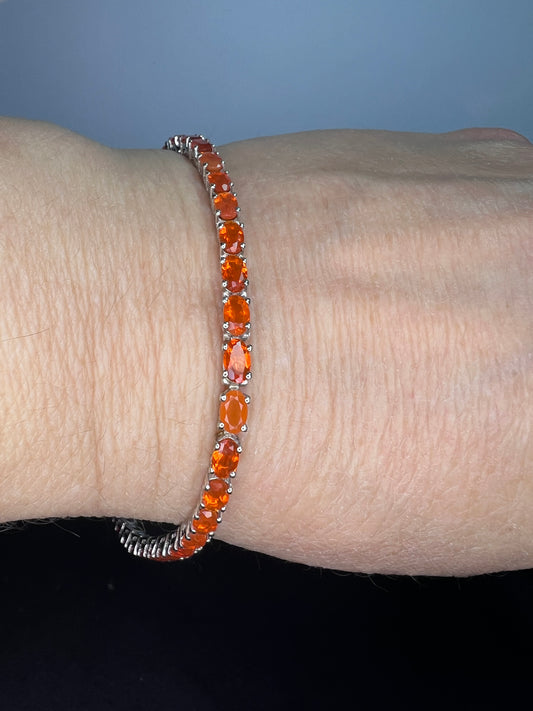 Mexican fire opal rhodium over sterling silver tennis bracelet