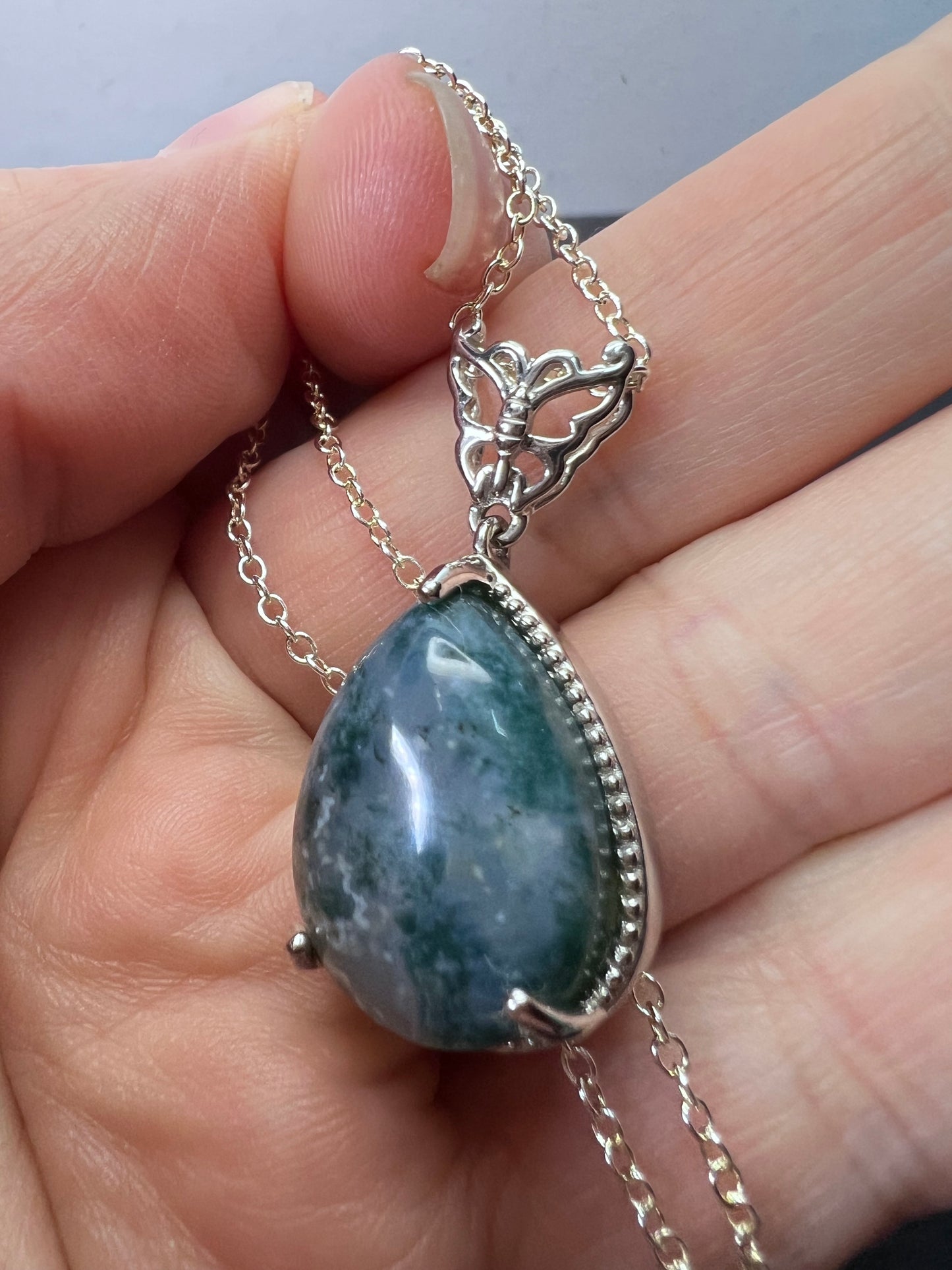 Moss agate teardrop pendant with butterfly in platinum over copper with 18 inch chain