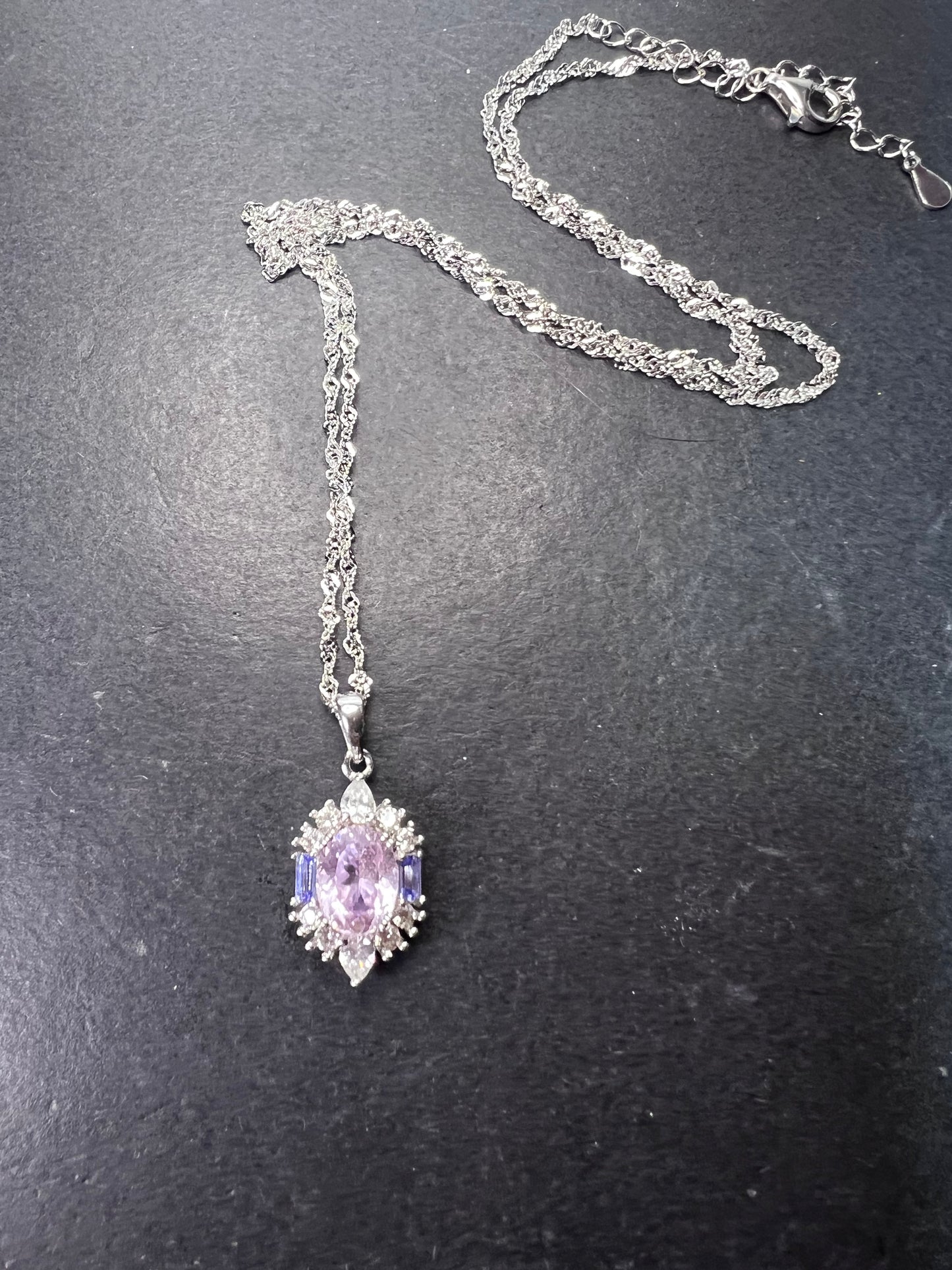 2.11ct Kunzite, 0.18ctw Tanzanite And 0.87ctw White Zircon Rhodium Over Silver halo Pendant With Chain