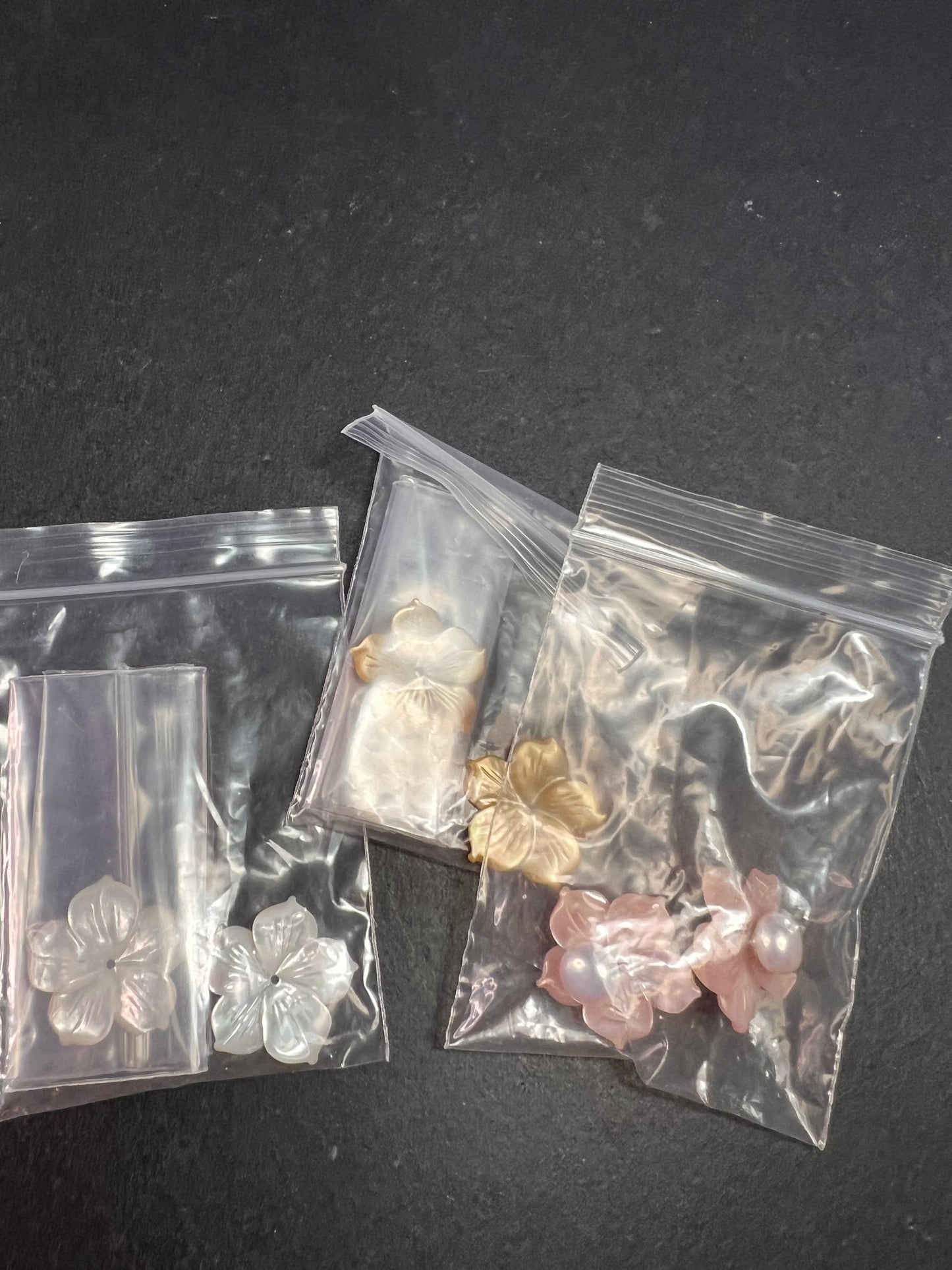 Vintage dead stock set of mother of pearl plumeria stud earrings in sterling silver