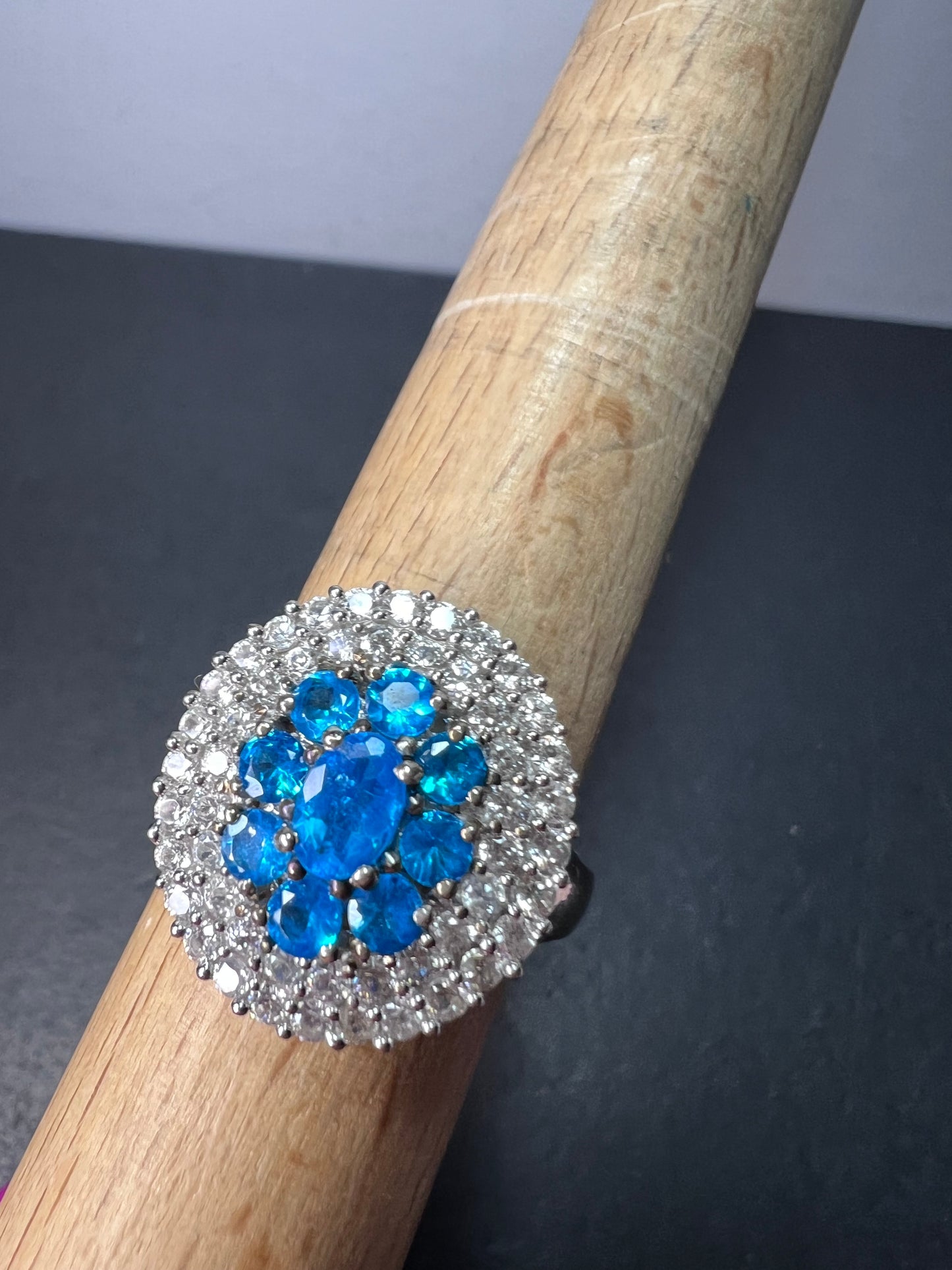 Neon blue apatite and white spinel halo cocktail ring in sterling silver size 9