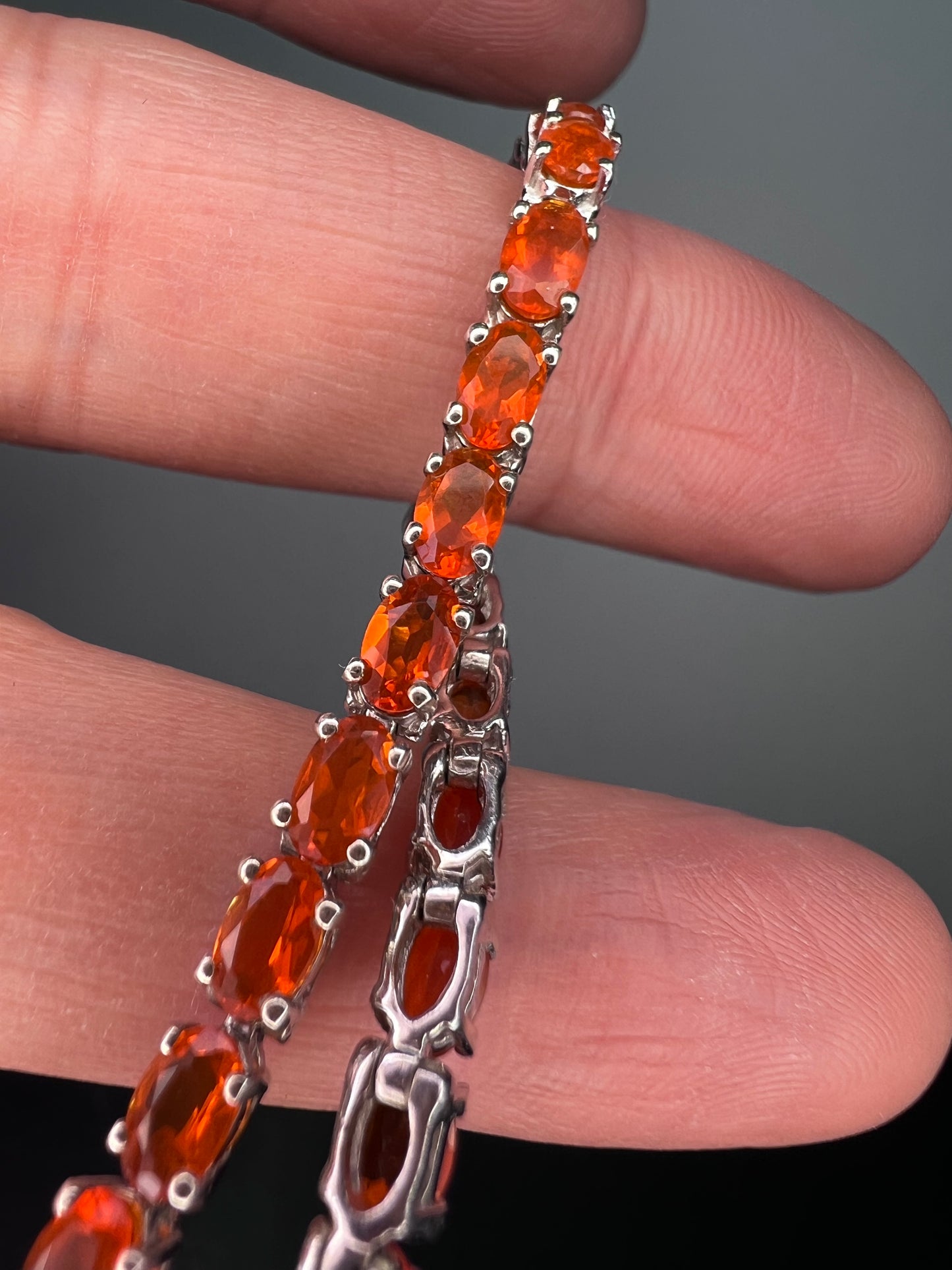 Mexican fire opal rhodium over sterling silver tennis bracelet