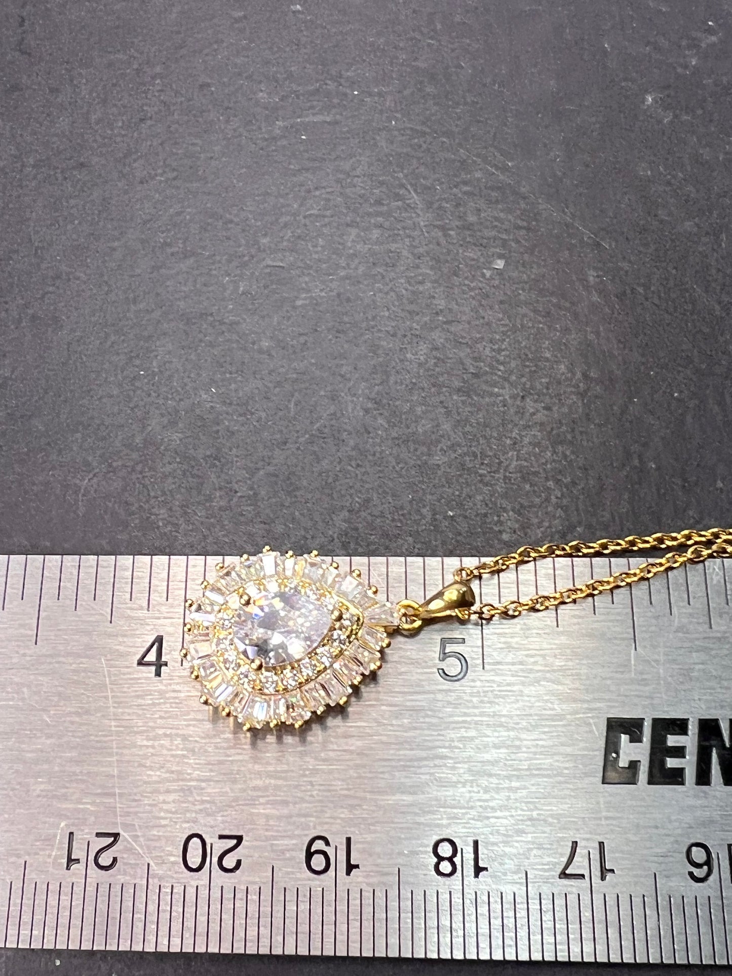 White CZ teardrop halo gold over Sterling pendant with gold over stainless steel chain necklace