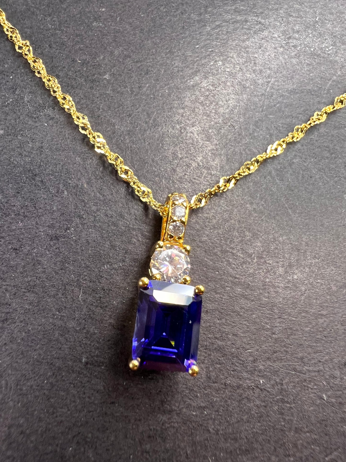 Blue emerald cut CZ pendant and chain necklace in gold over sterling silver 18 inches