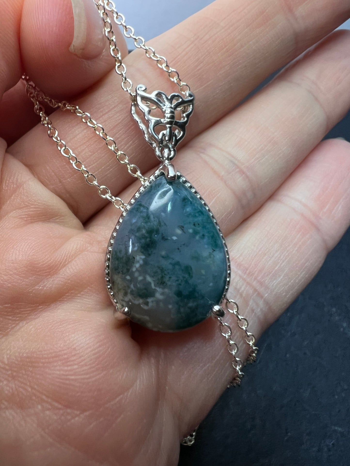 Moss agate teardrop pendant with butterfly in platinum over copper with 18 inch chain