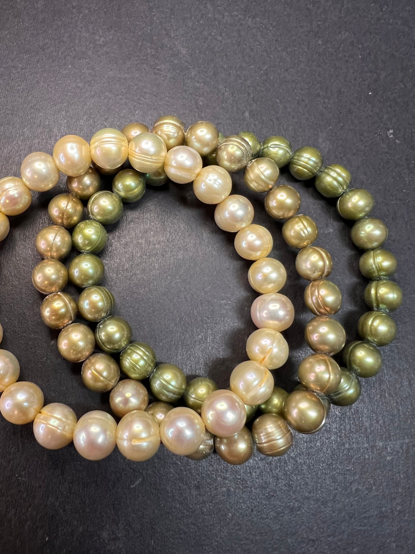 Set of three freshwater pearl shades of green stretch bracelets
