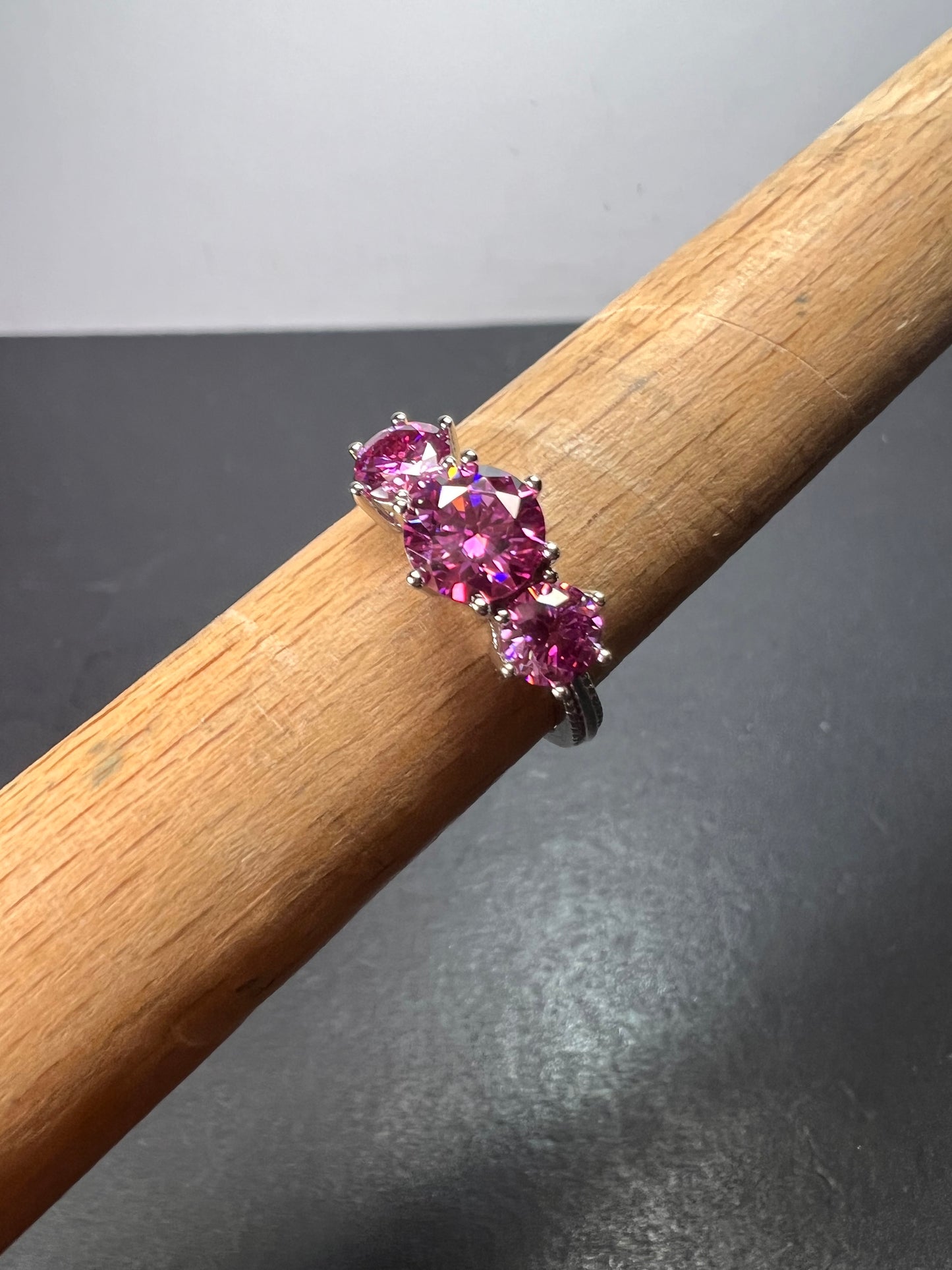 Pink moissanite trilogy ring in platinum over sterling silver size 7