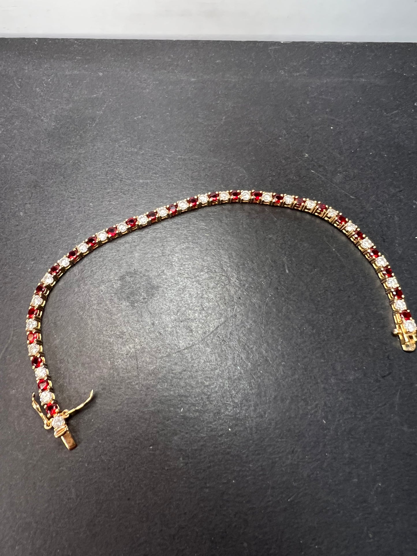 Red white CZ tennis bracelet in gold over 925 sterling silver