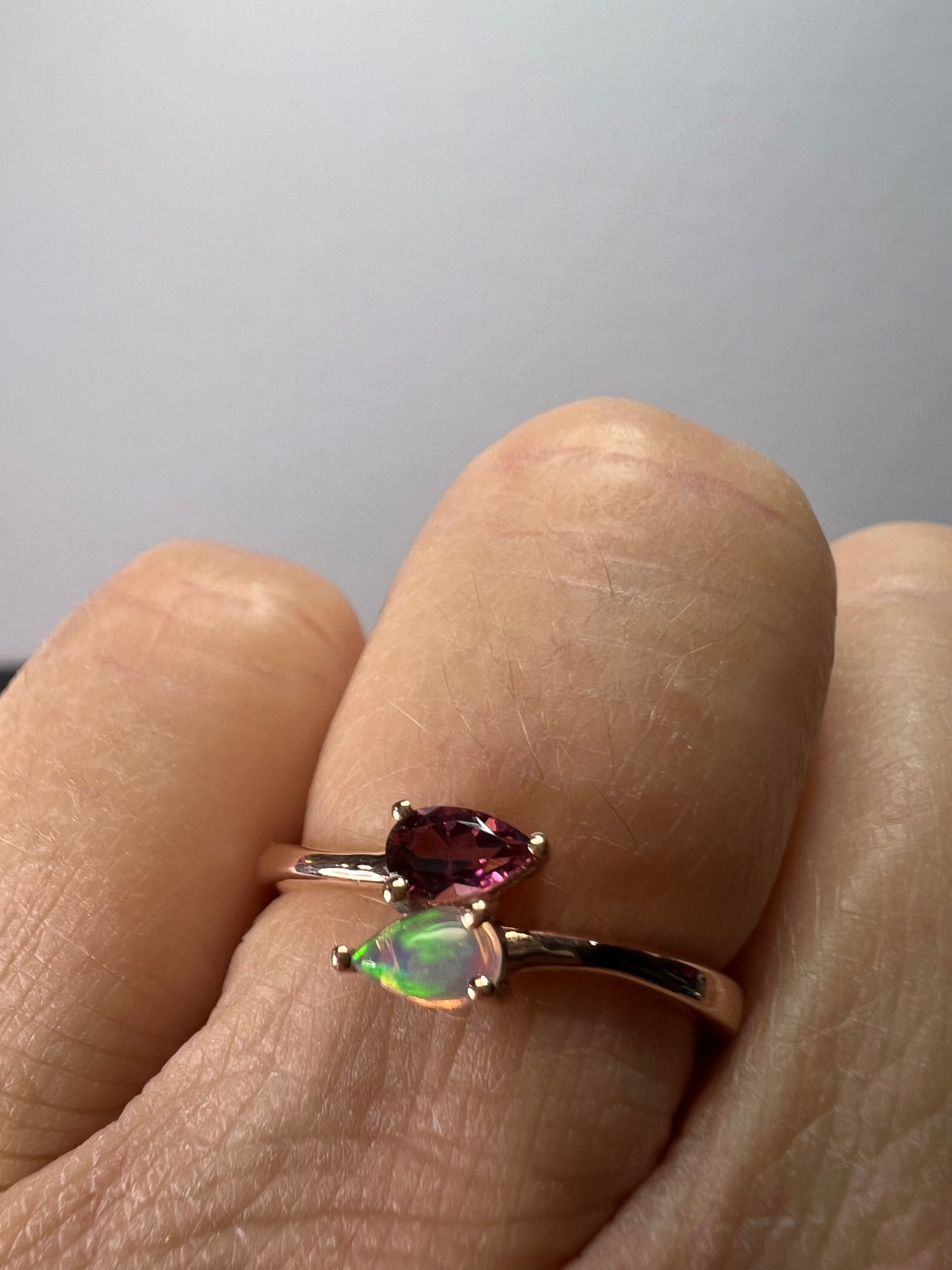 Rubellite and Ethiopian welo opal bypass ring in rose gold vermeil over sterling silver size 7. .35ctw