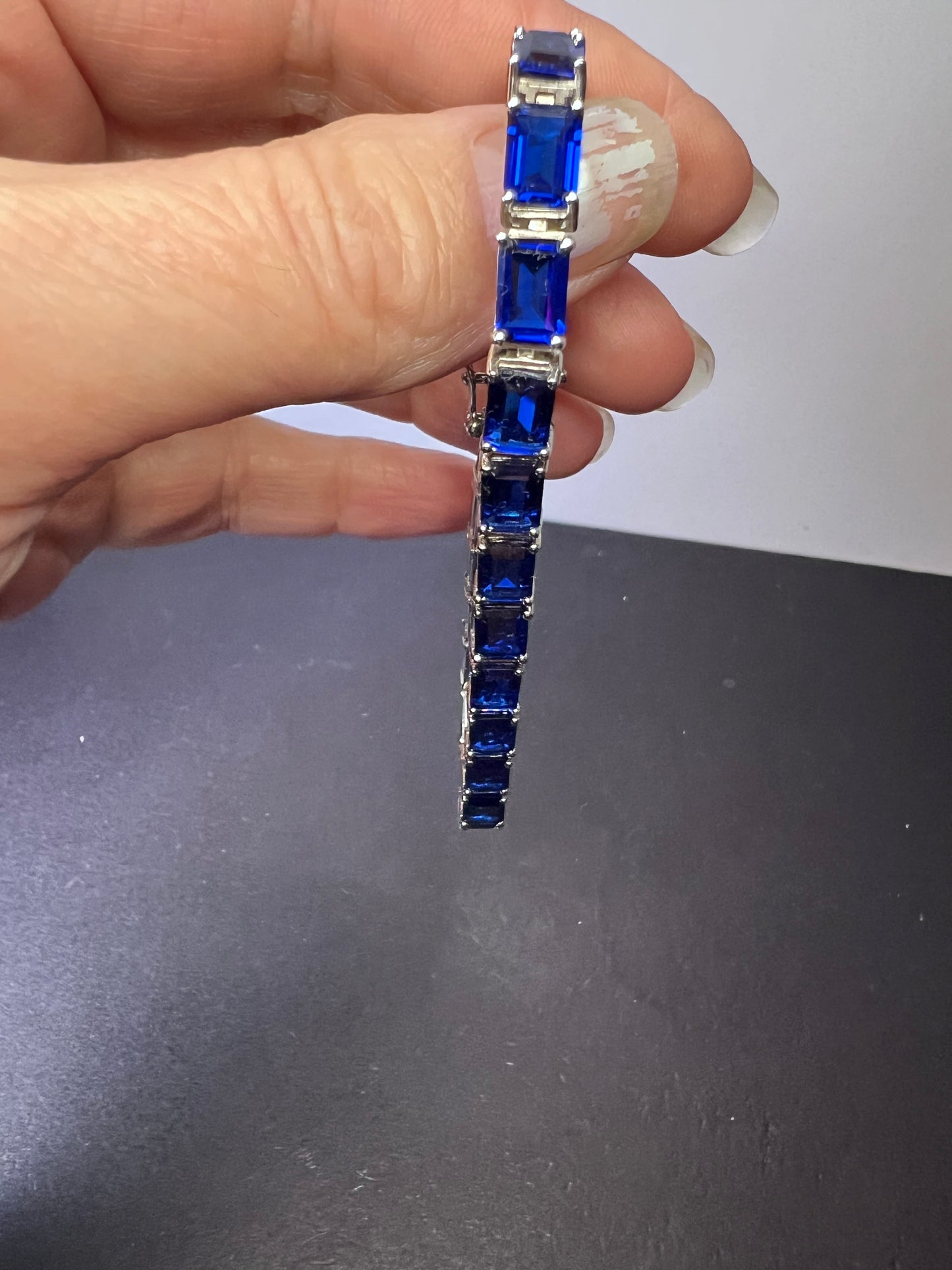 Lab created blue spinel emerald cut tennis bracelet in platinum over sterling silver 22.92 ctw