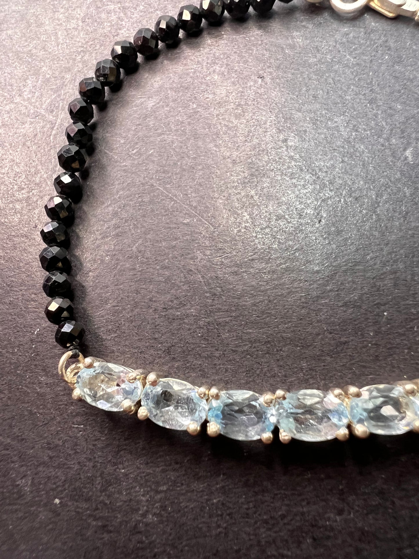 Black spinel and blue topaz bracelet with sterling lobster clasp