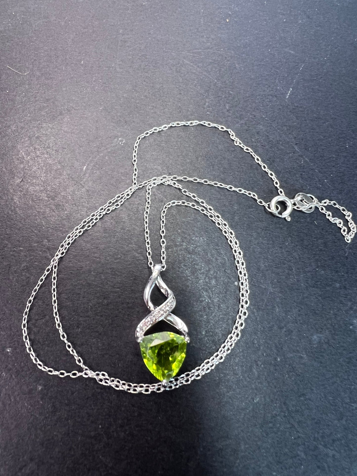 Trilliant cut peridot and sterling silver pendant and 18 inch chain