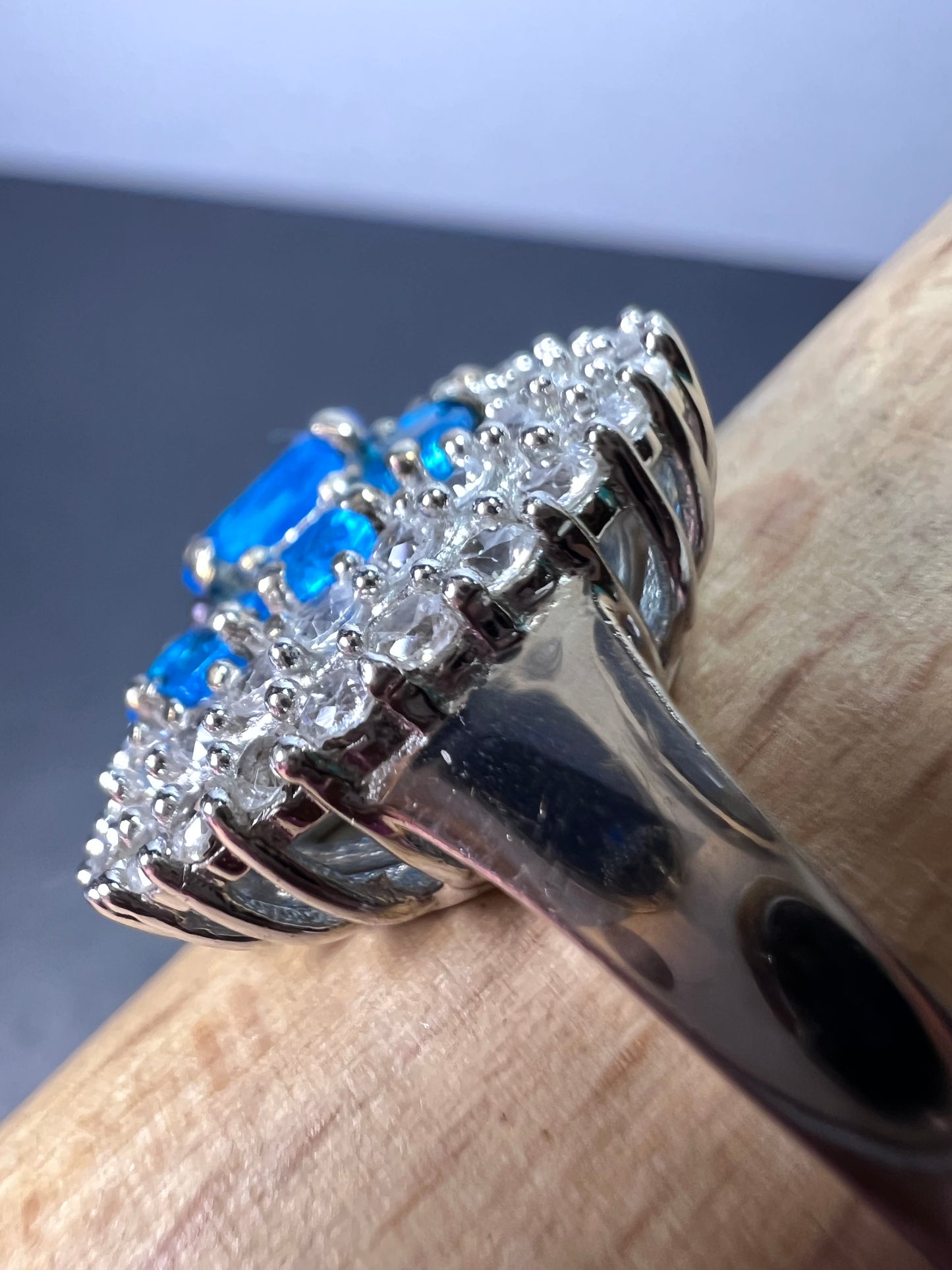 Neon blue apatite and white spinel halo cocktail ring in sterling silver size 9