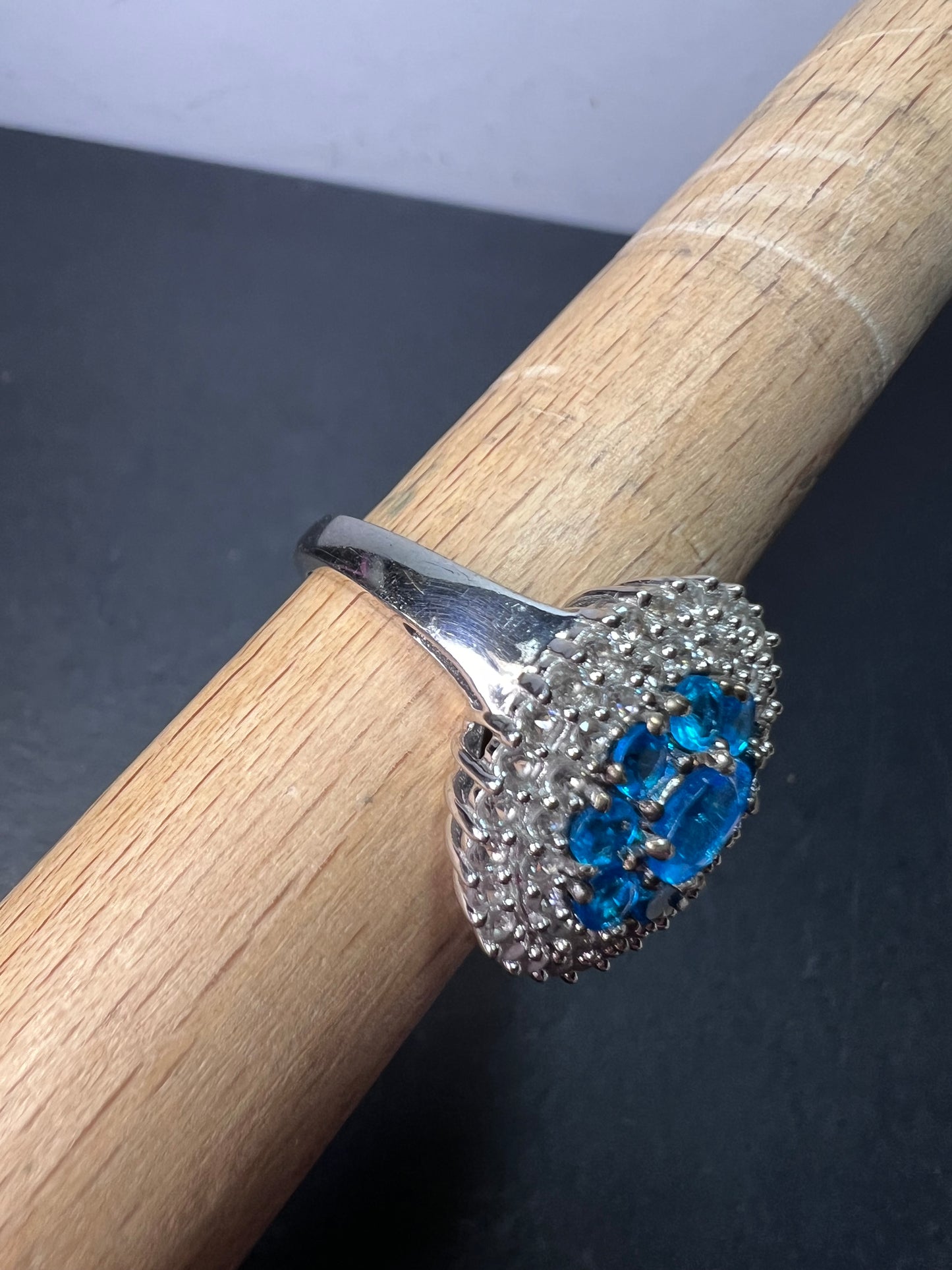 Neon blue apatite and white spinel halo cocktail ring in sterling silver size 9