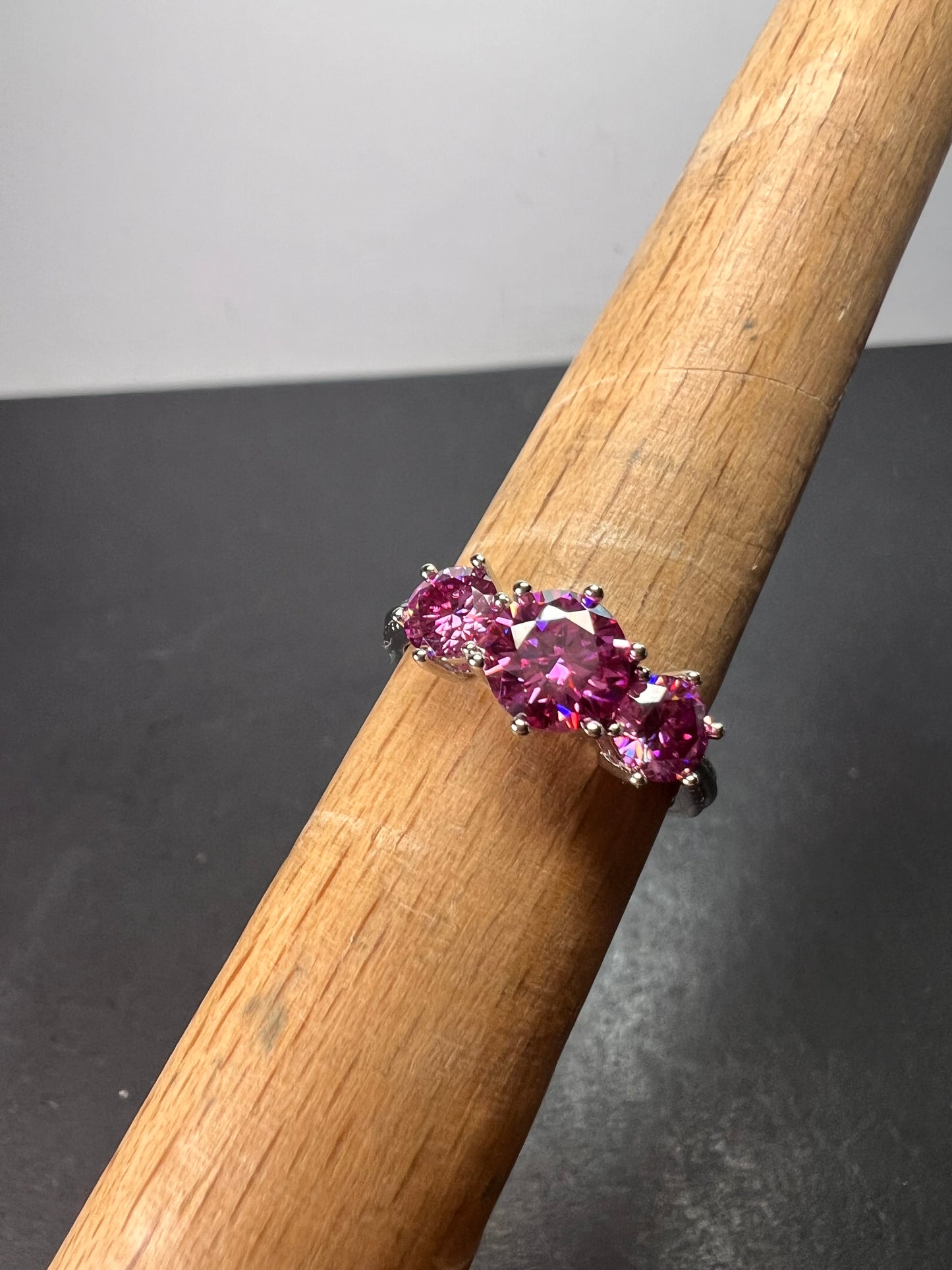 Pink moissanite trilogy ring in platinum over sterling silver size 7