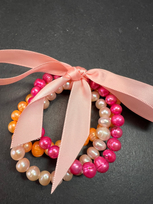 Set of three freshwater pearl stretch bracelets fuchsia pink to tangerine