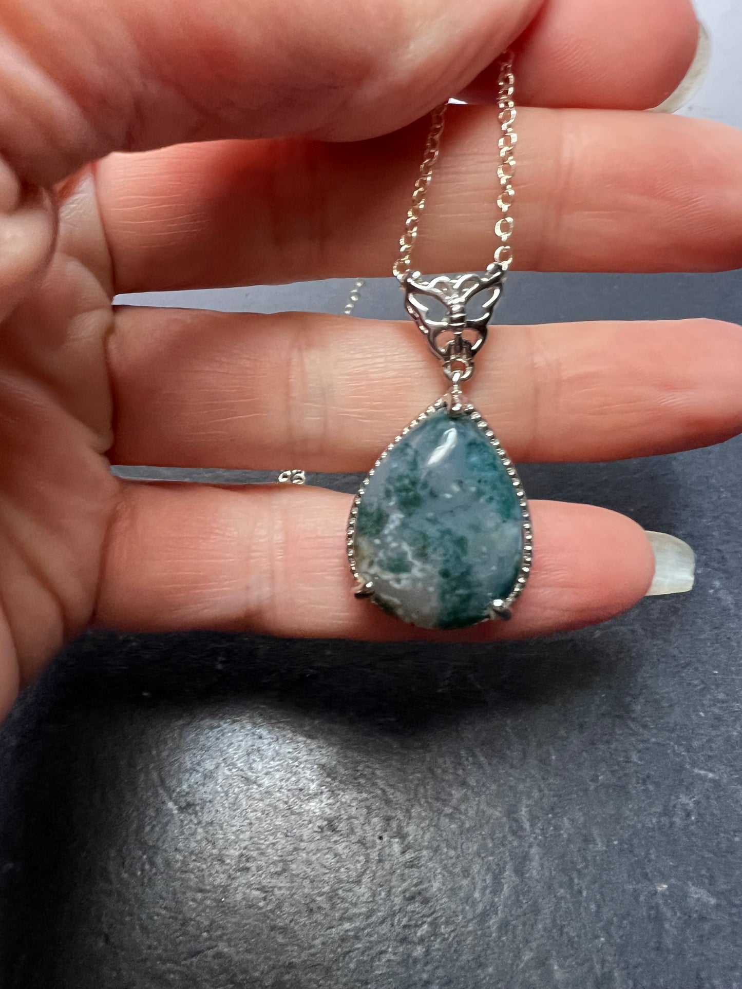 Moss agate teardrop pendant with butterfly in platinum over copper with 18 inch chain