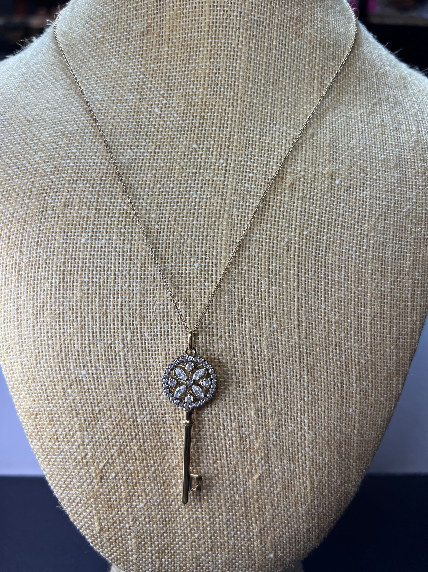 Gold over sterling silver key pendant necklace with Cz stones