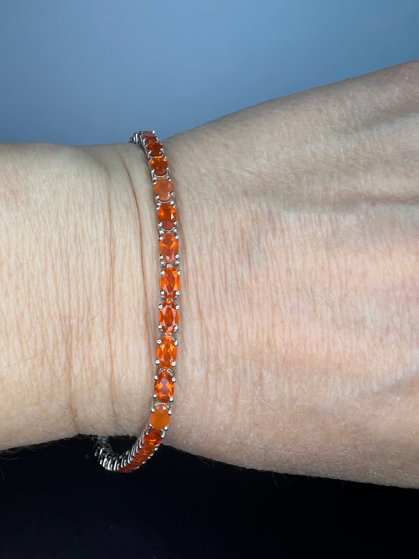 Mexican fire opal rhodium over sterling silver tennis bracelet