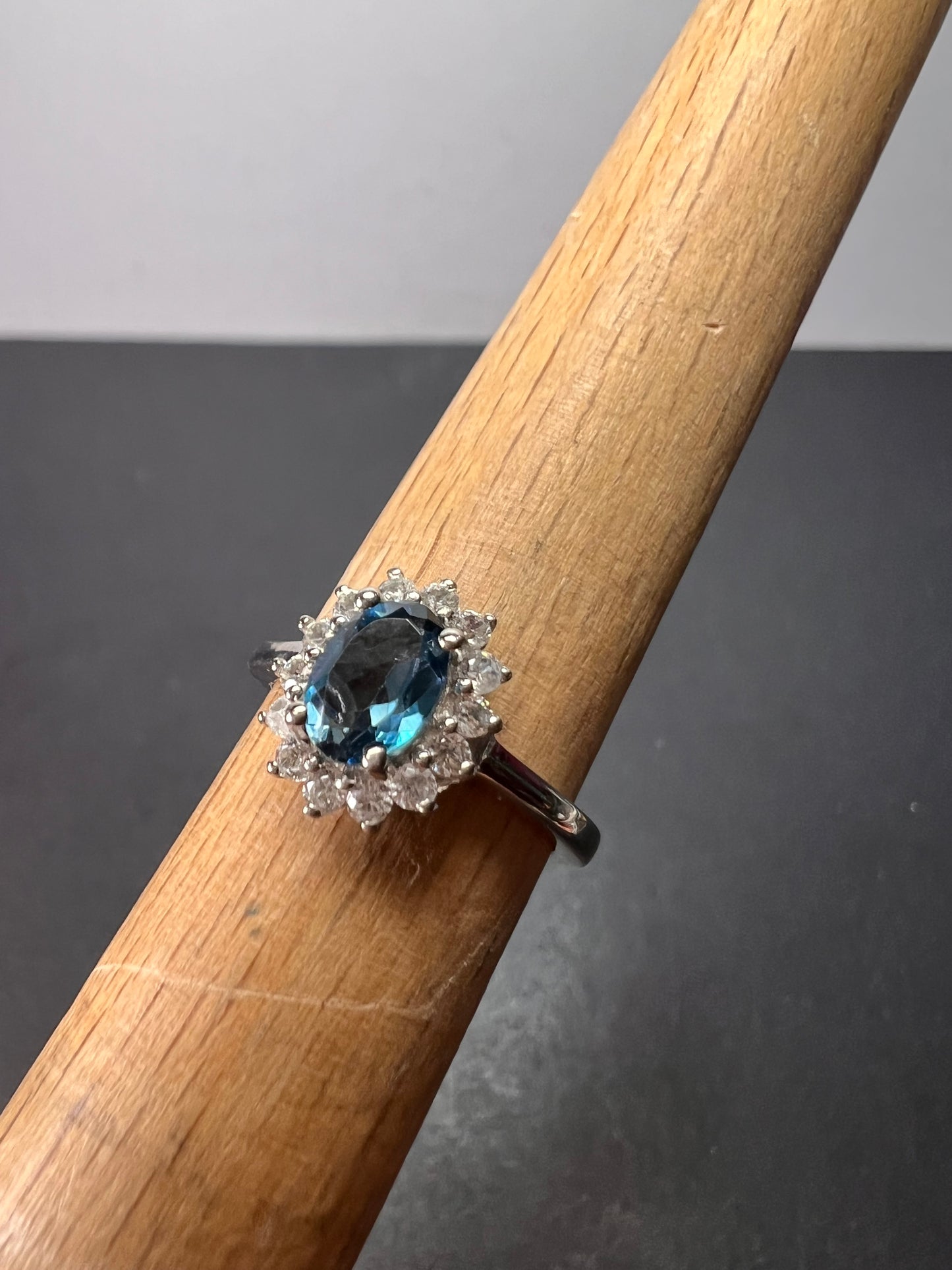 London blue topaz sunburst halo ring in platinum over sterling silver. ctw 1.40 size 5