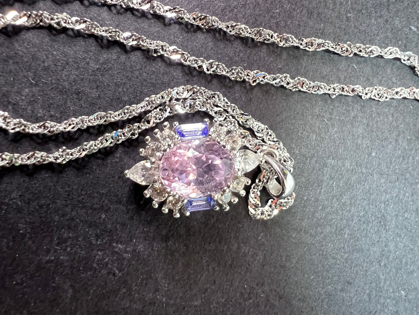 2.11ct Kunzite, 0.18ctw Tanzanite And 0.87ctw White Zircon Rhodium Over Silver halo Pendant With Chain