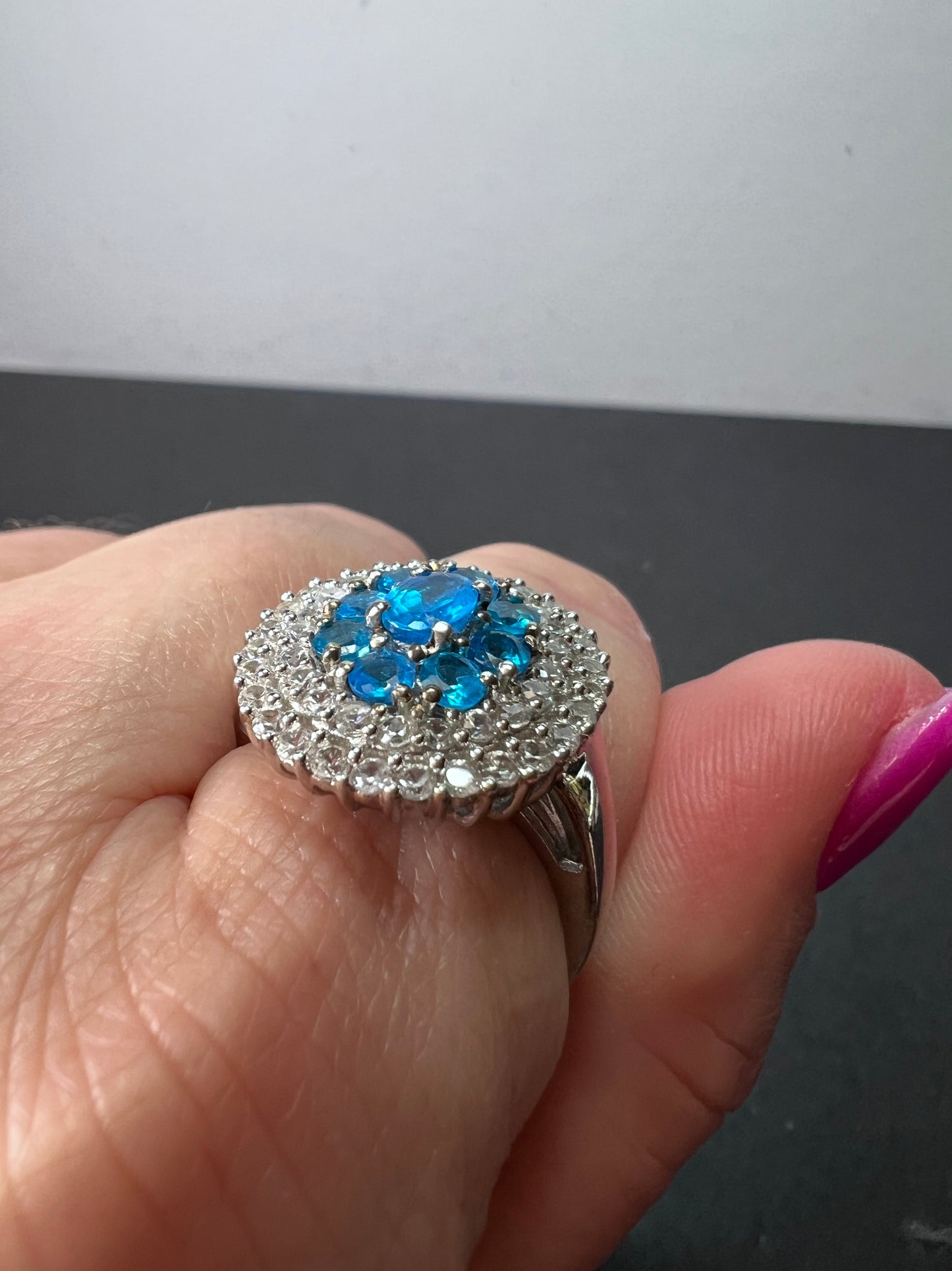 Neon blue apatite and white spinel halo cocktail ring in sterling silver size 9