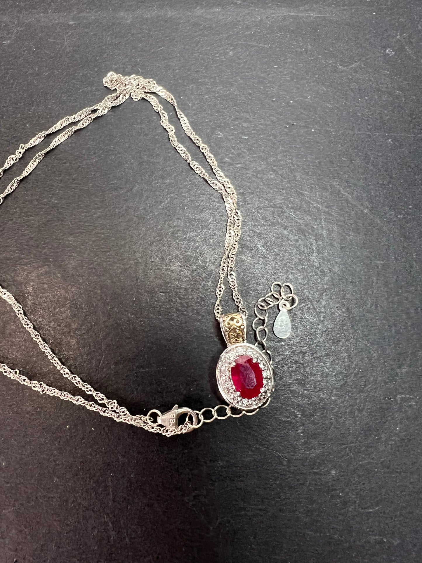 Ruby and zircon two toned halo pendant and chain necklace in sterling silver