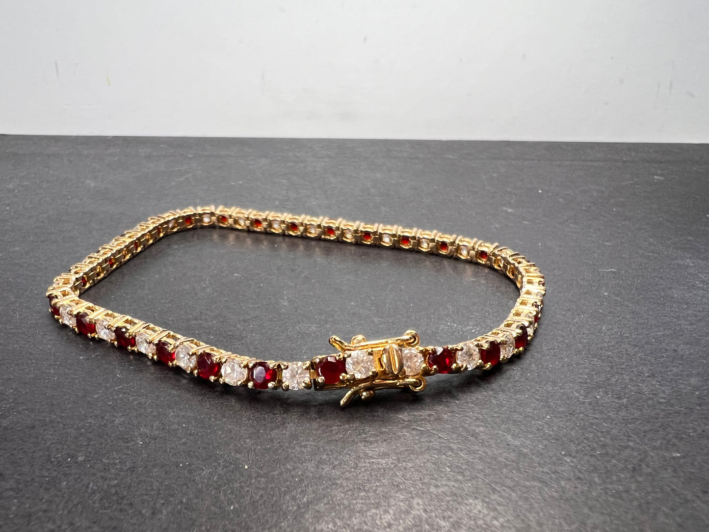 Red white CZ tennis bracelet in gold over 925 sterling silver