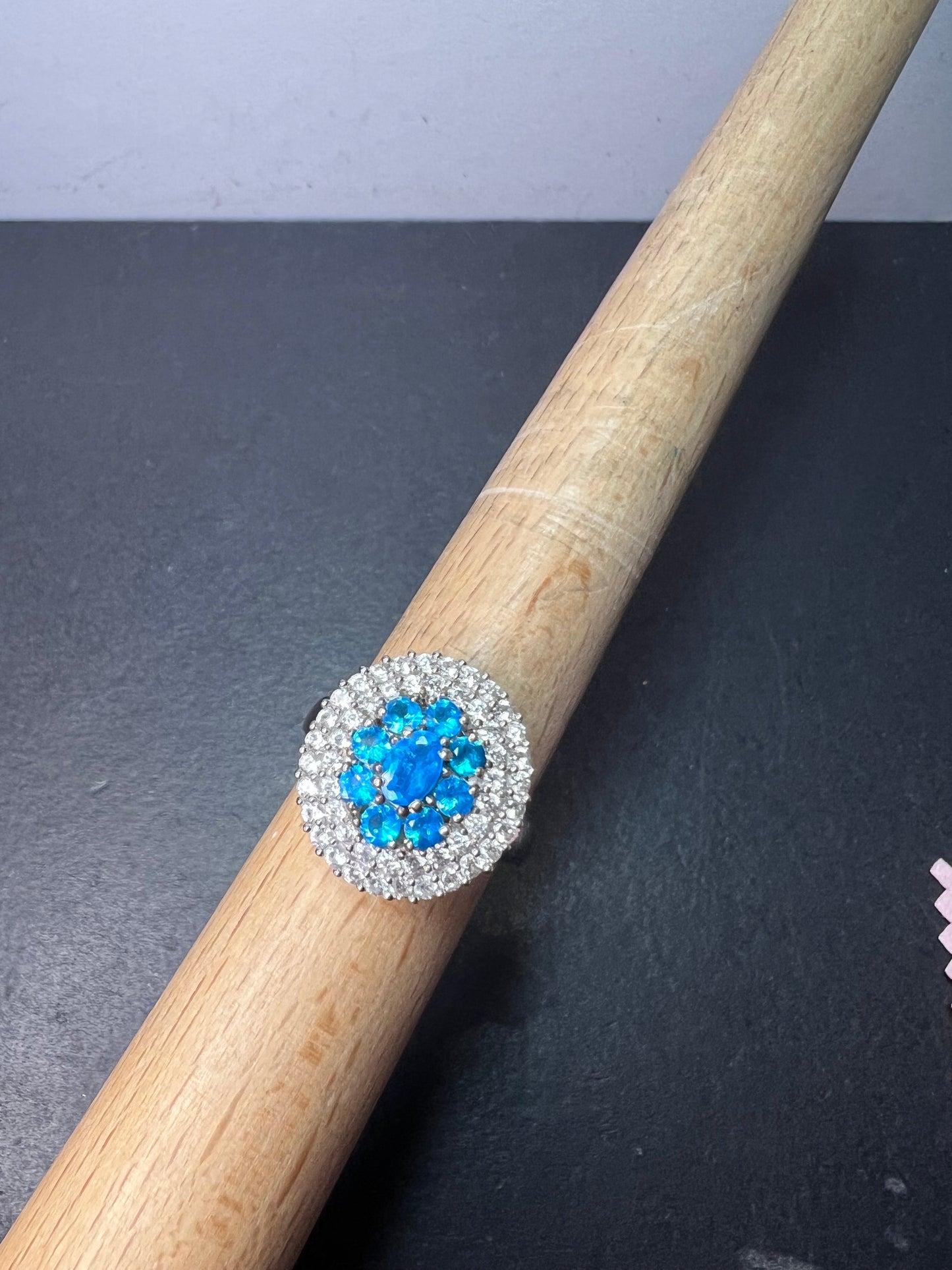 Neon blue apatite and white spinel halo cocktail ring in sterling silver size 9