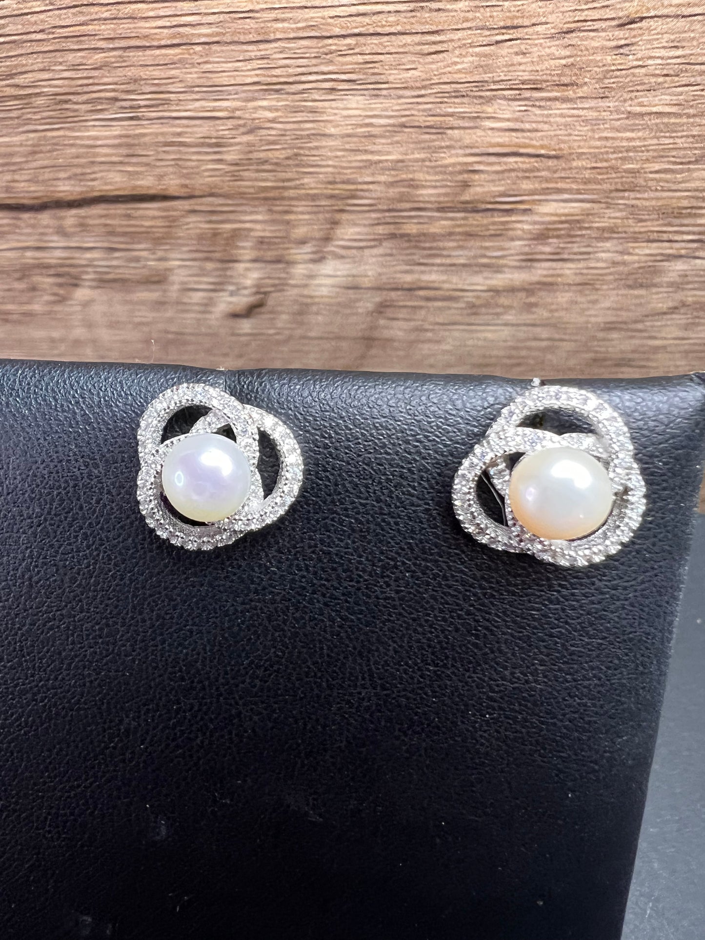 Cultured pearl swirl stud earrings in sterling silver with cz accents