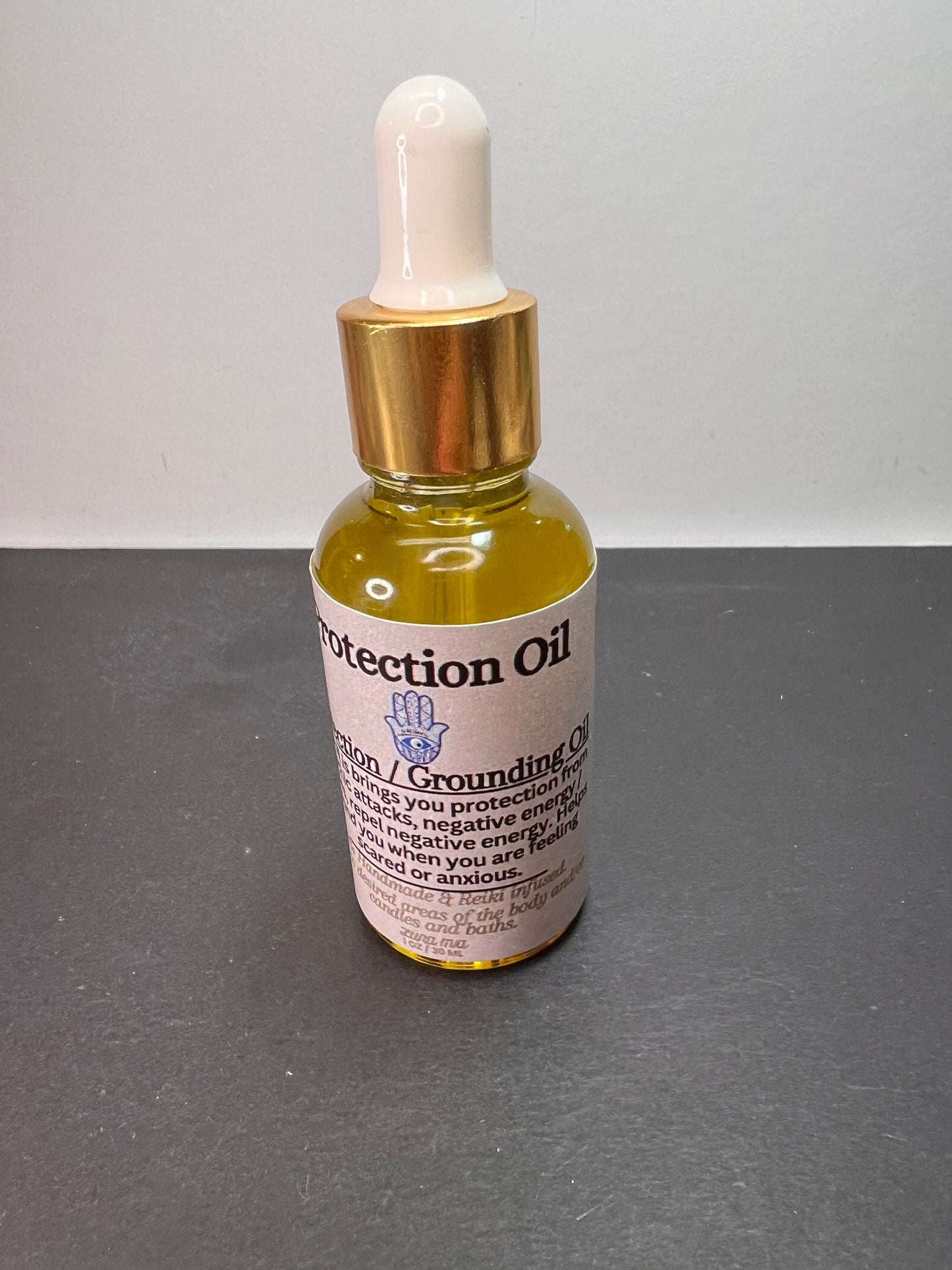 Protection and grounding oil by Luna Mia