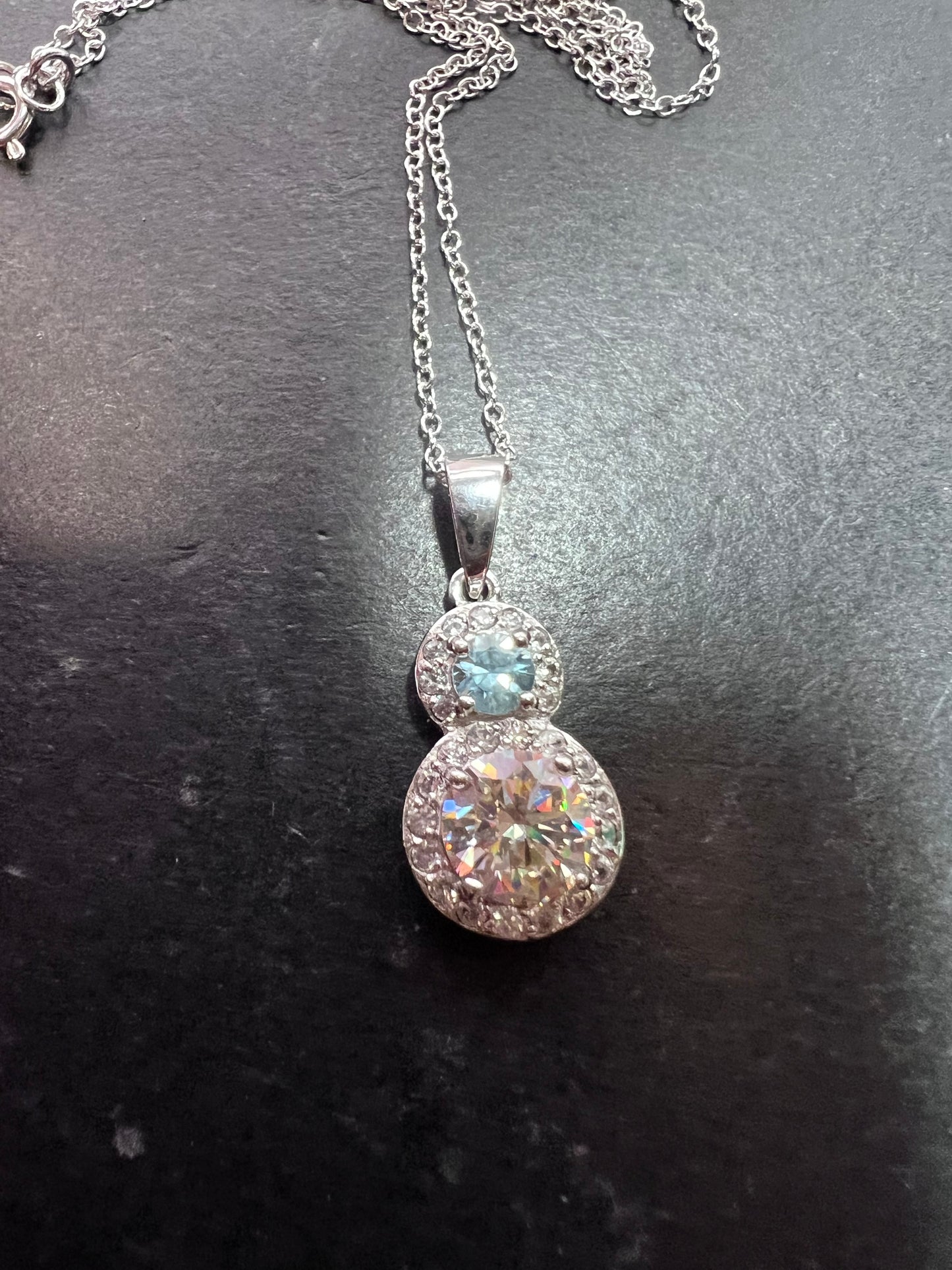 Strontium titanate and blue topaz sterling silver halo pendant with 18 inch chain necklace