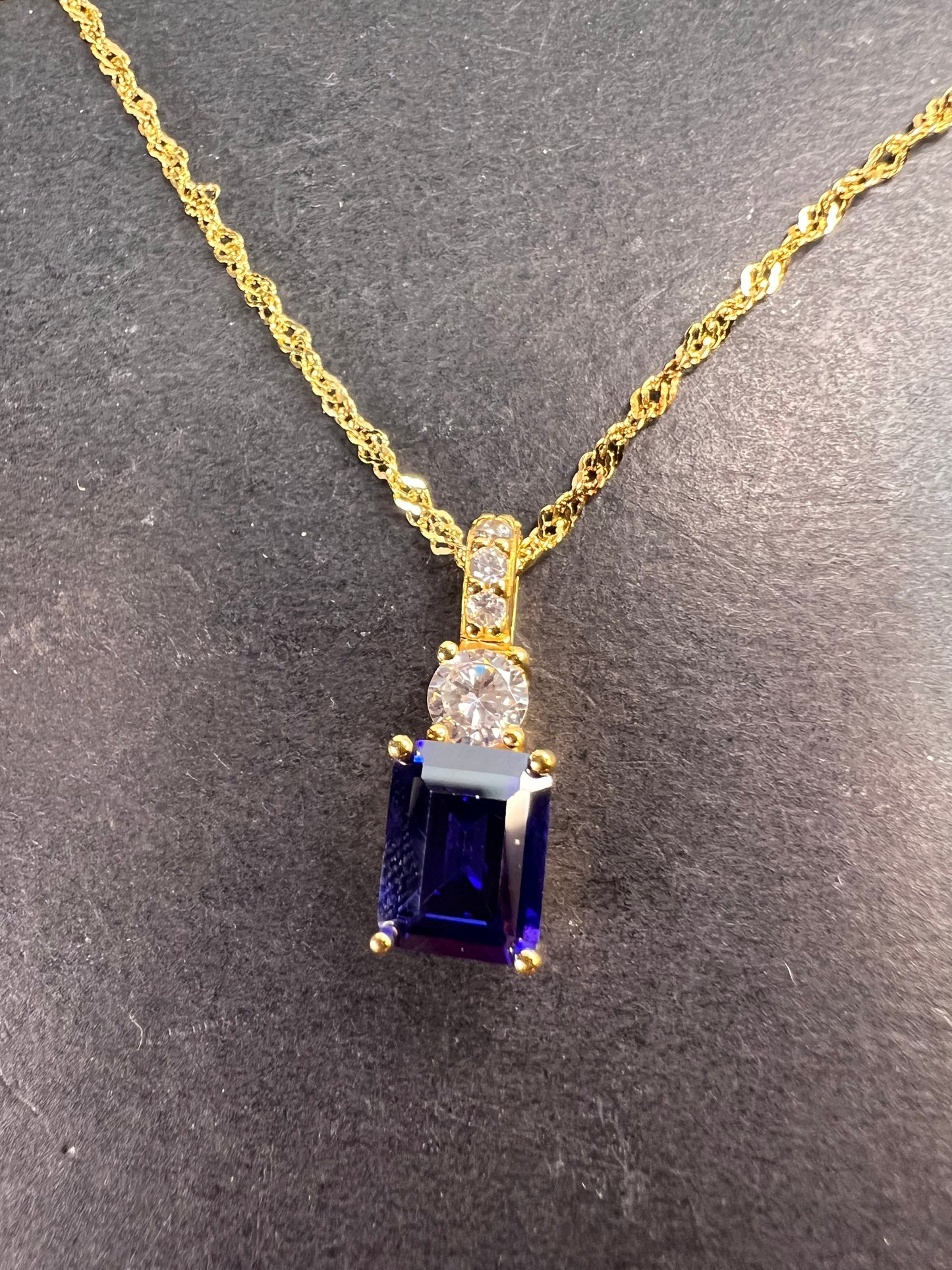 Blue emerald cut CZ pendant and chain necklace in gold over sterling silver 18 inches