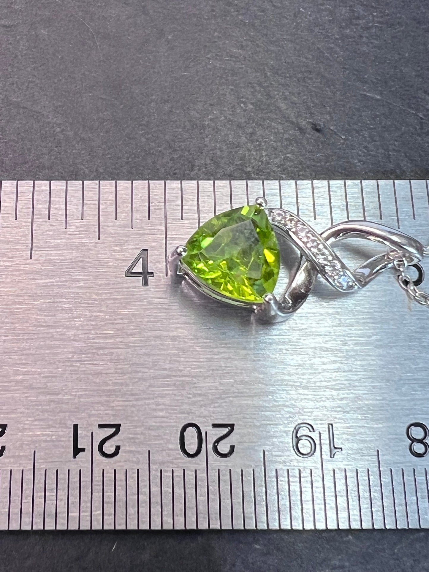 Trilliant cut peridot and sterling silver pendant and 18 inch chain