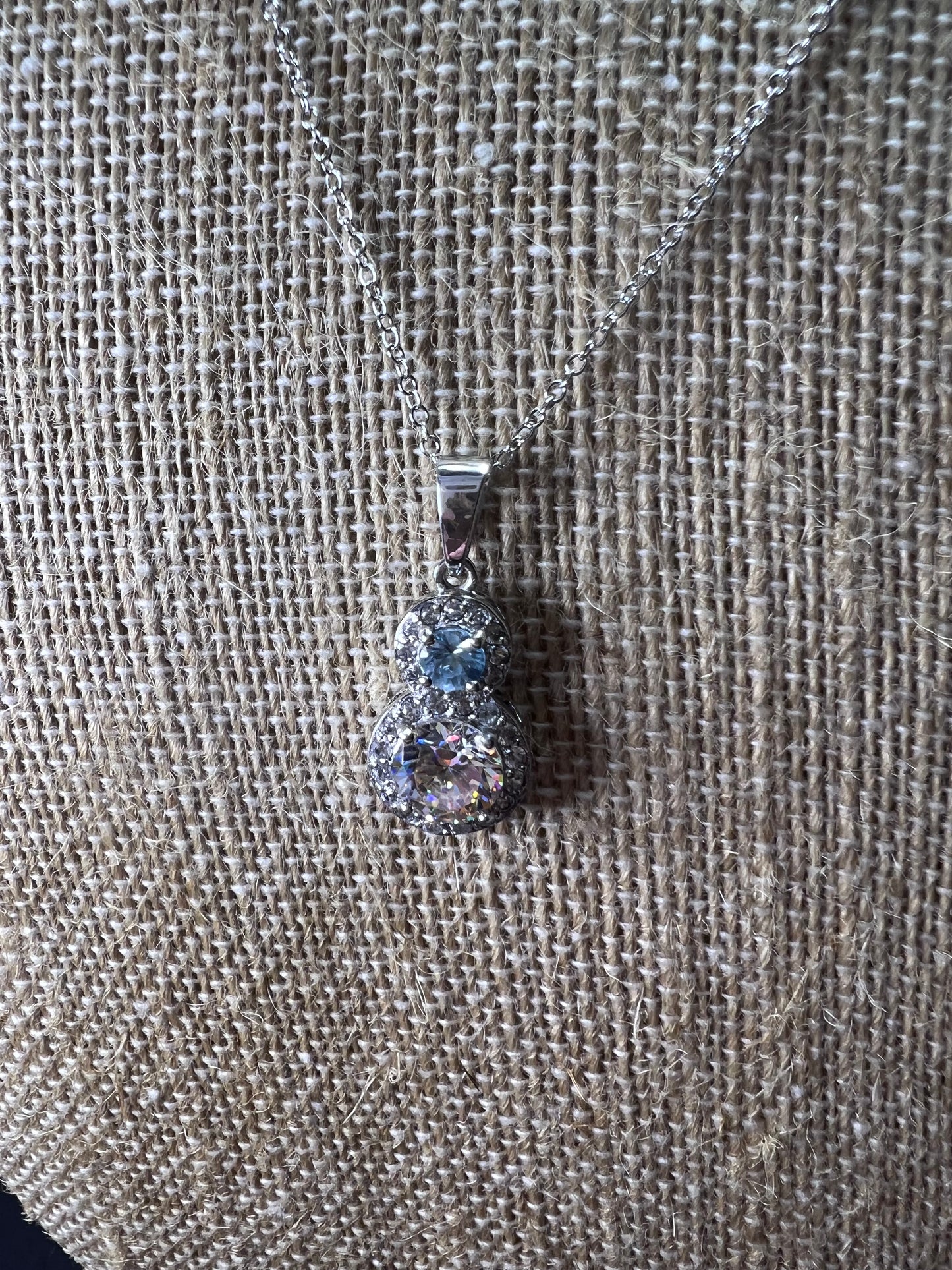 Strontium titanate and blue topaz sterling silver halo pendant with 18 inch chain necklace