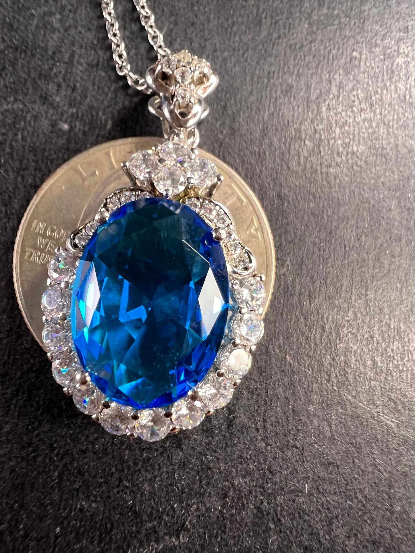 Blue and white CZ sterling silver halo pendant