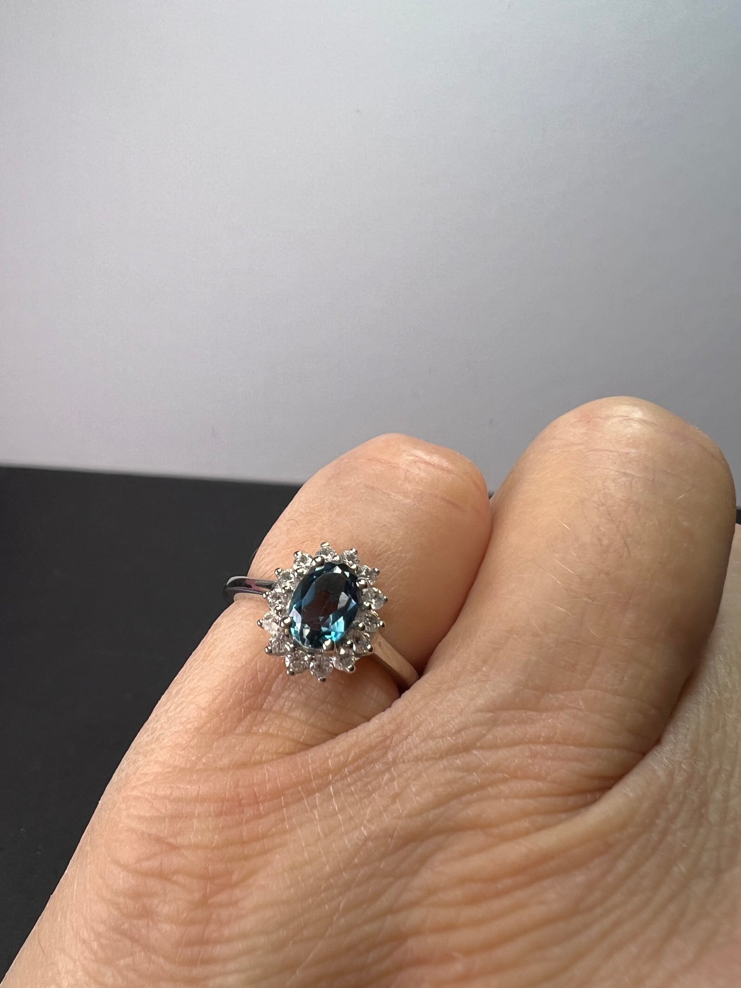 London blue topaz sunburst halo ring in platinum over sterling silver. ctw 1.40 size 5