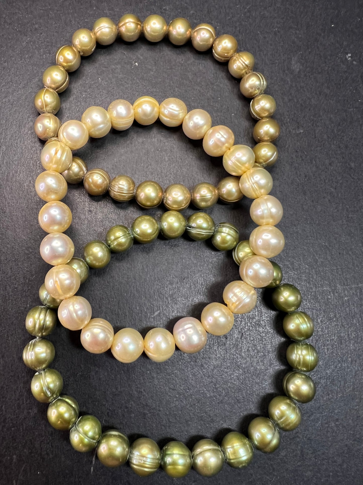 Set of three freshwater pearl shades of green stretch bracelets
