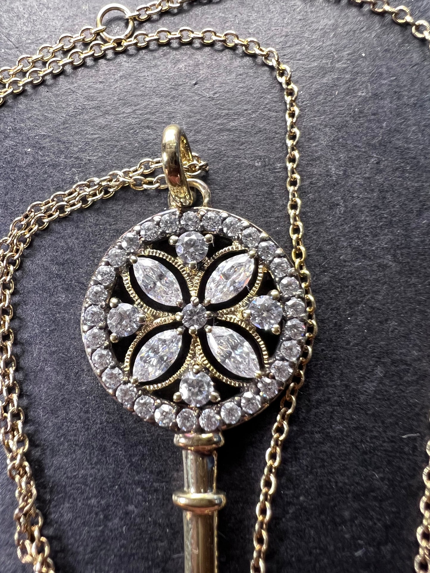 Gold over sterling silver key pendant necklace with Cz stones