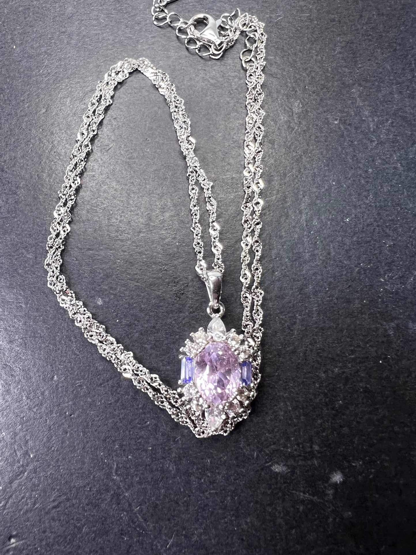 2.11ct Kunzite, 0.18ctw Tanzanite And 0.87ctw White Zircon Rhodium Over Silver halo Pendant With Chain