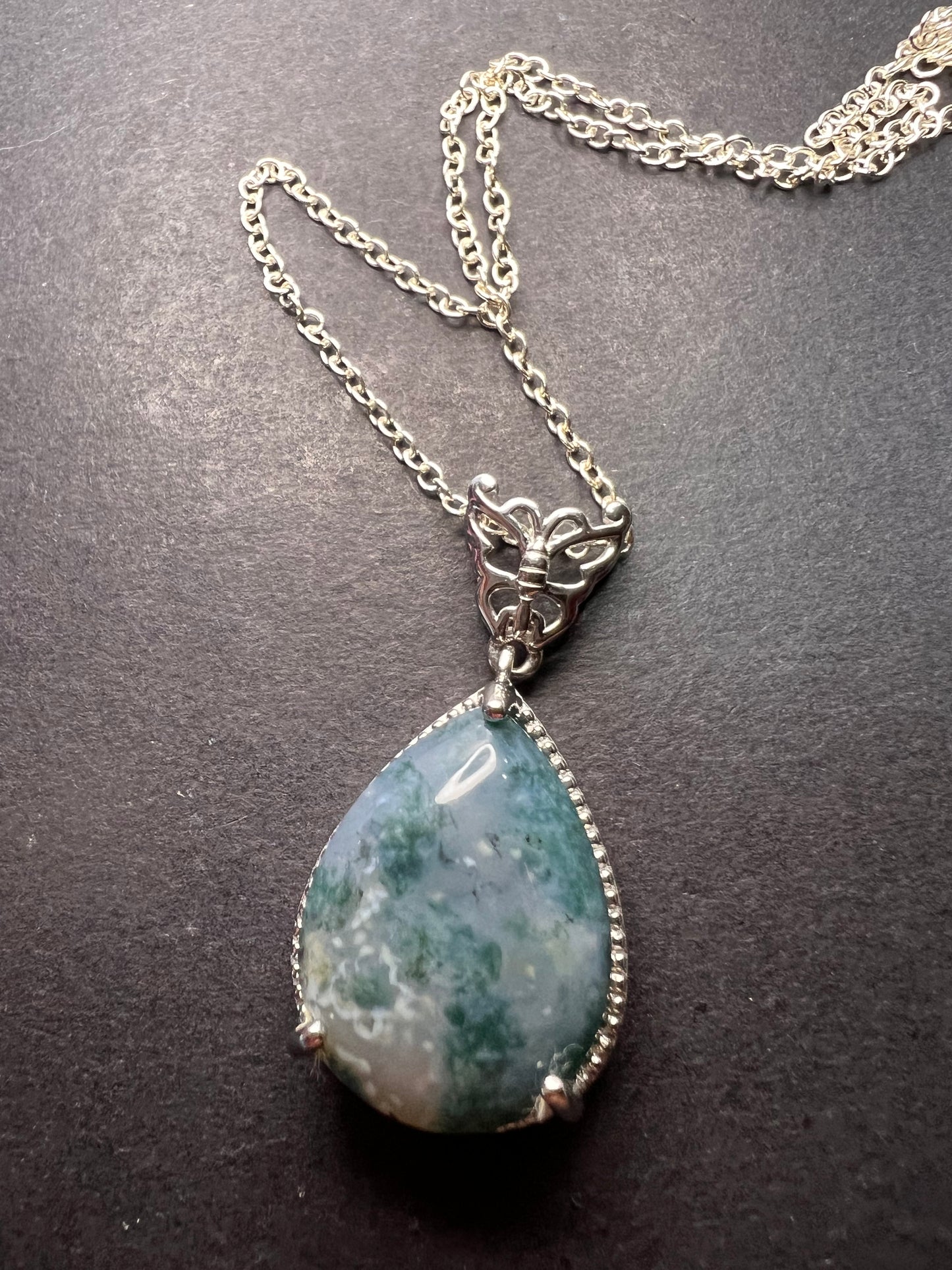 Moss agate teardrop pendant with butterfly in platinum over copper with 18 inch chain