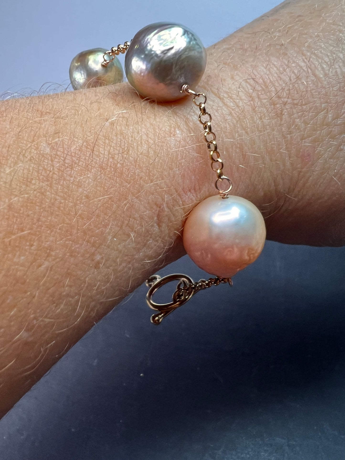 Multi colored baroque pearl station bracelet in rose gold over Sterling silver