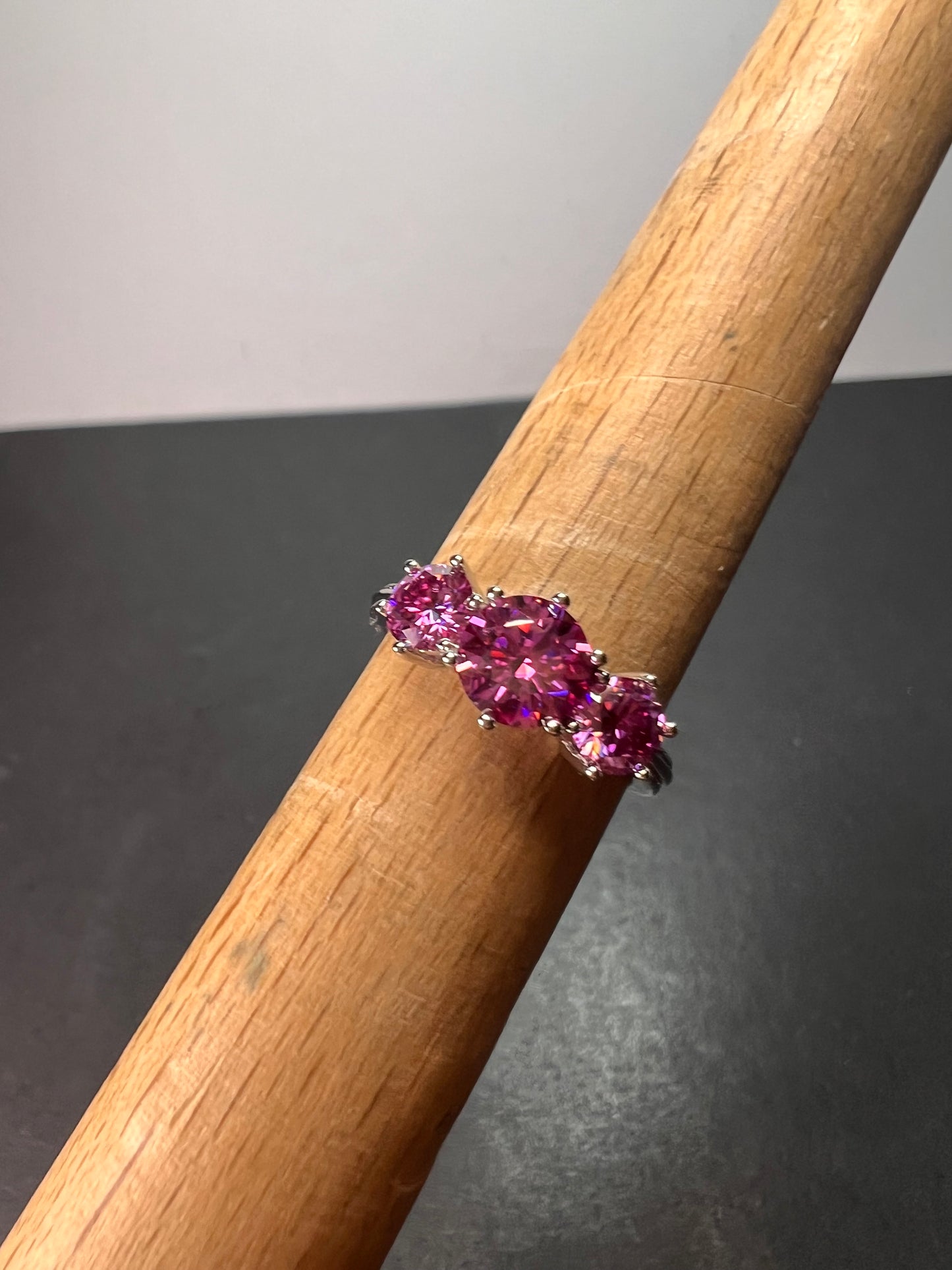 Pink moissanite trilogy ring in platinum over sterling silver size 7