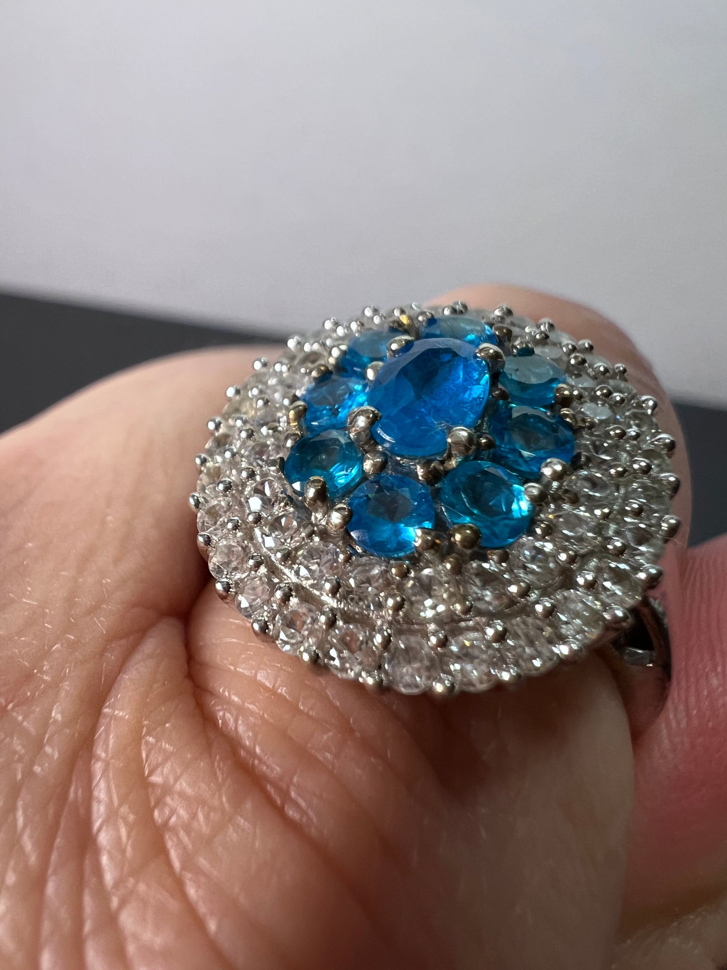 Neon blue apatite and white spinel halo cocktail ring in sterling silver size 9