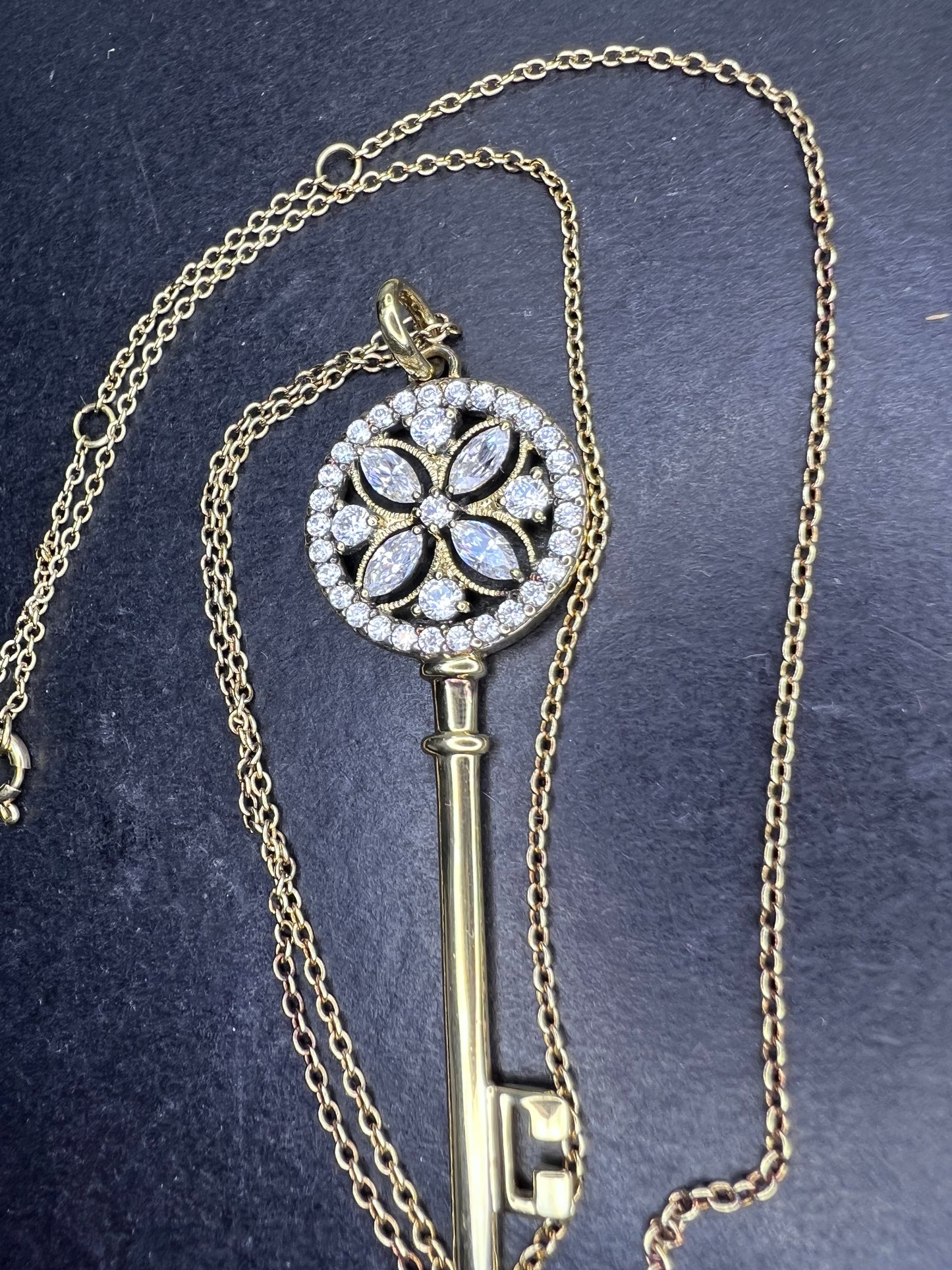 Gold over sterling silver key pendant necklace with Cz stones