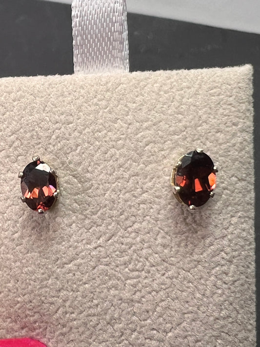 Oval cut red zircon sterling silver stud earrings