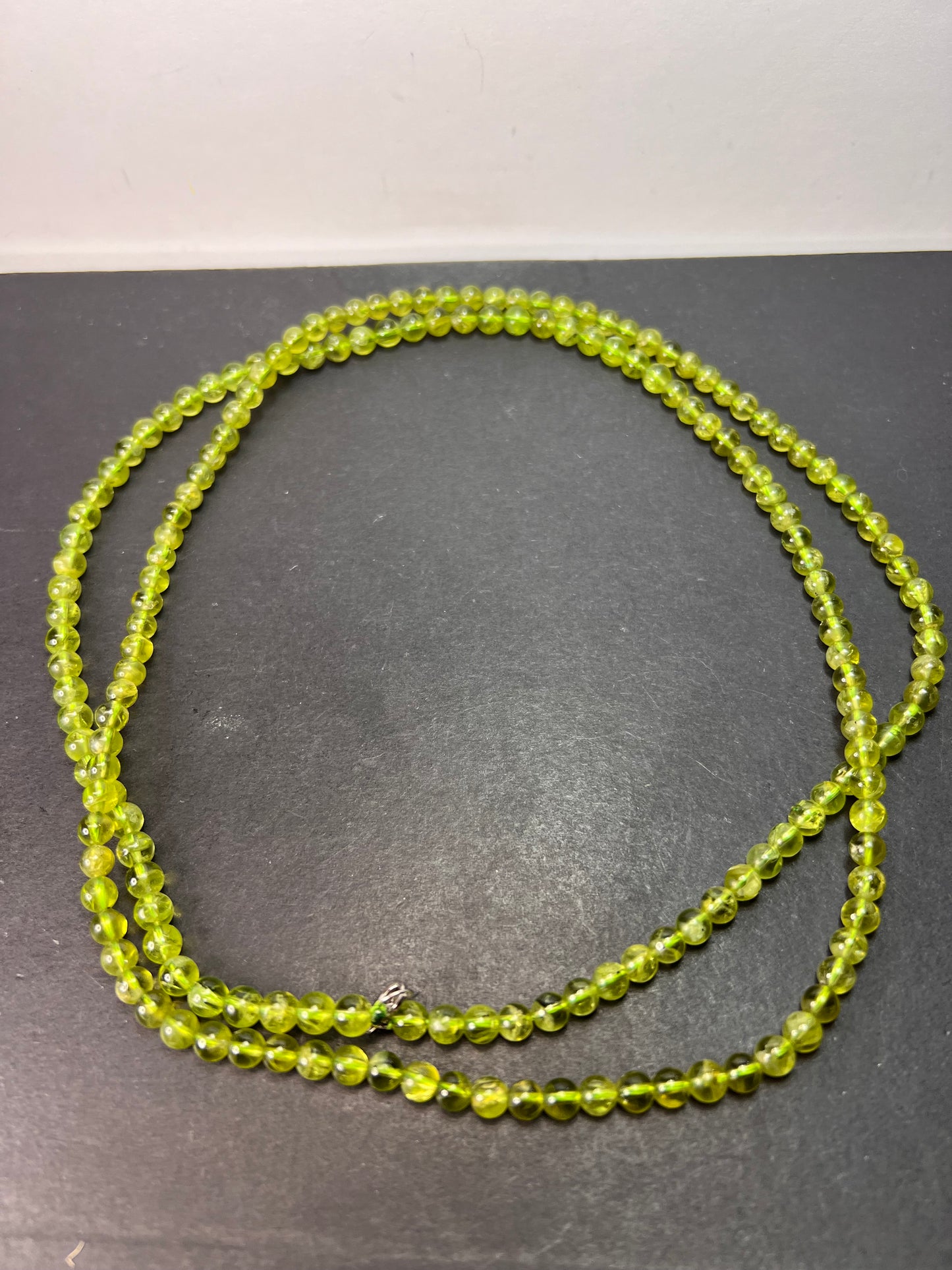 6mm high grade peridot beaded 36 inch necklace with sterling silver clasp