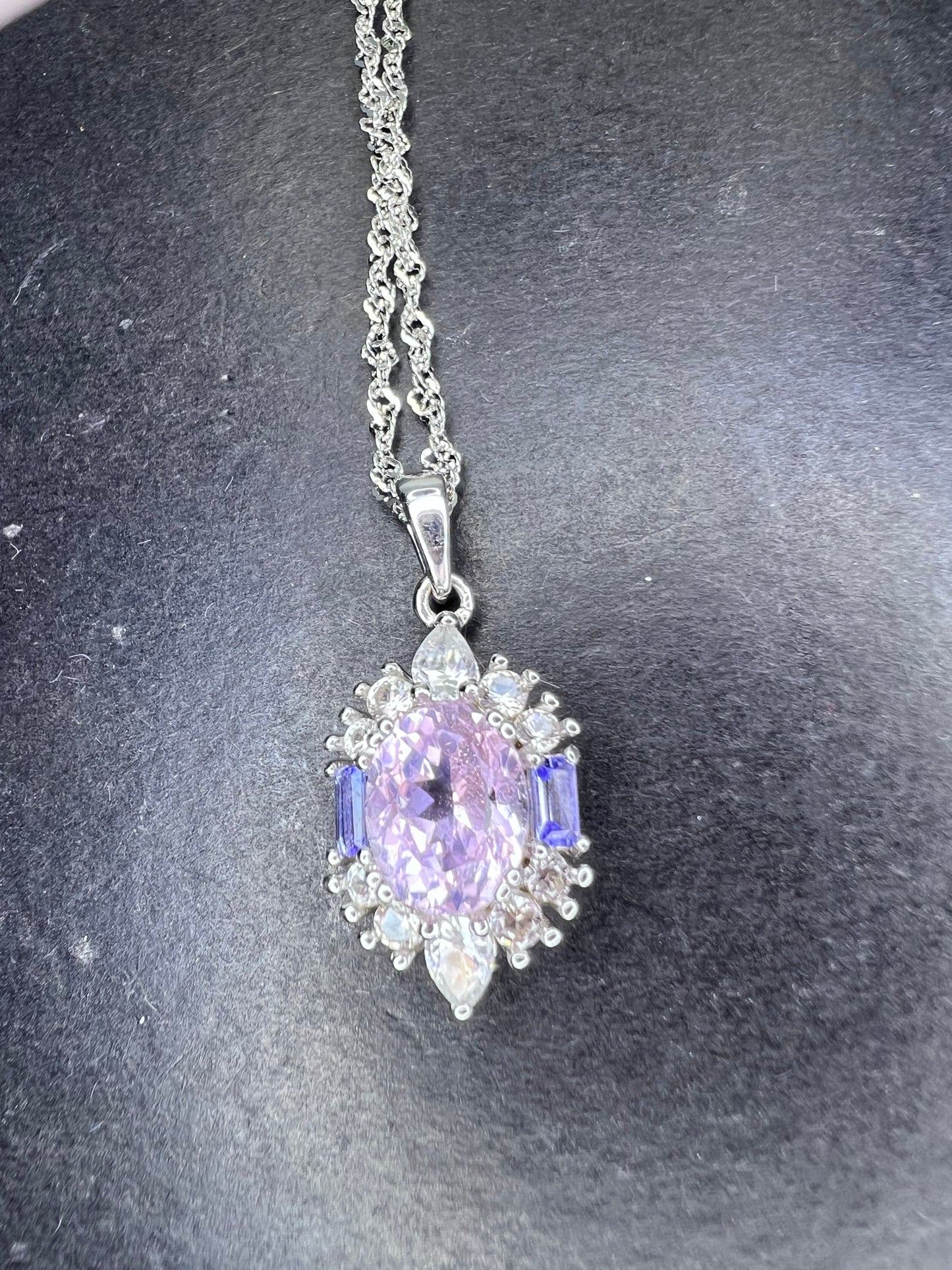 2.11ct Kunzite, 0.18ctw Tanzanite And 0.87ctw White Zircon Rhodium Over Silver halo Pendant With Chain