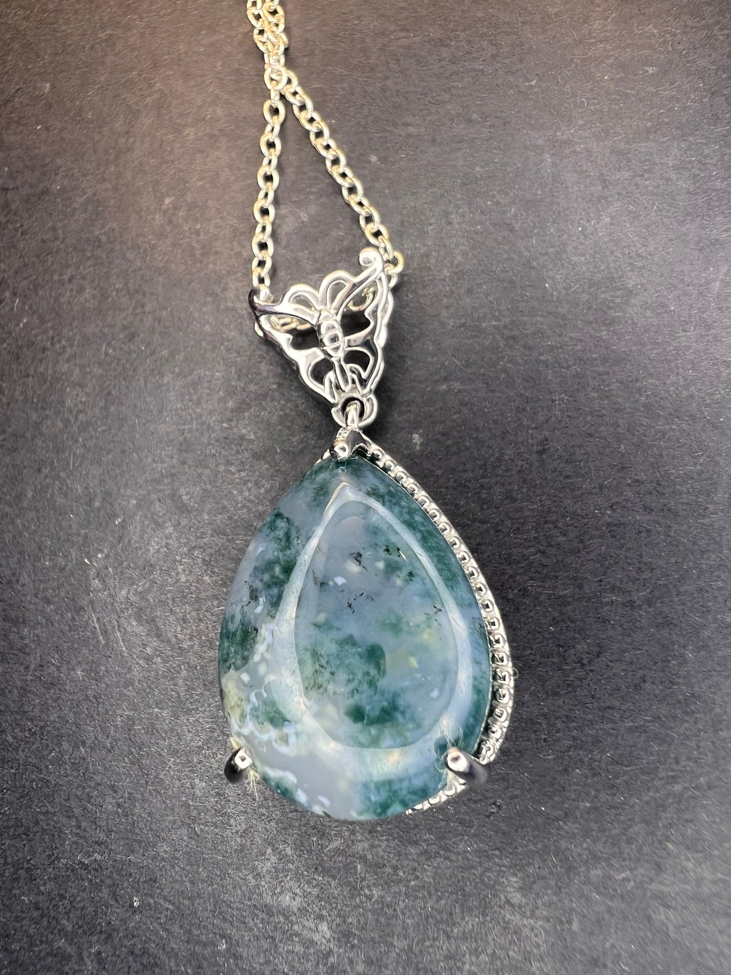 Moss agate teardrop pendant with butterfly in platinum over copper with 18 inch chain