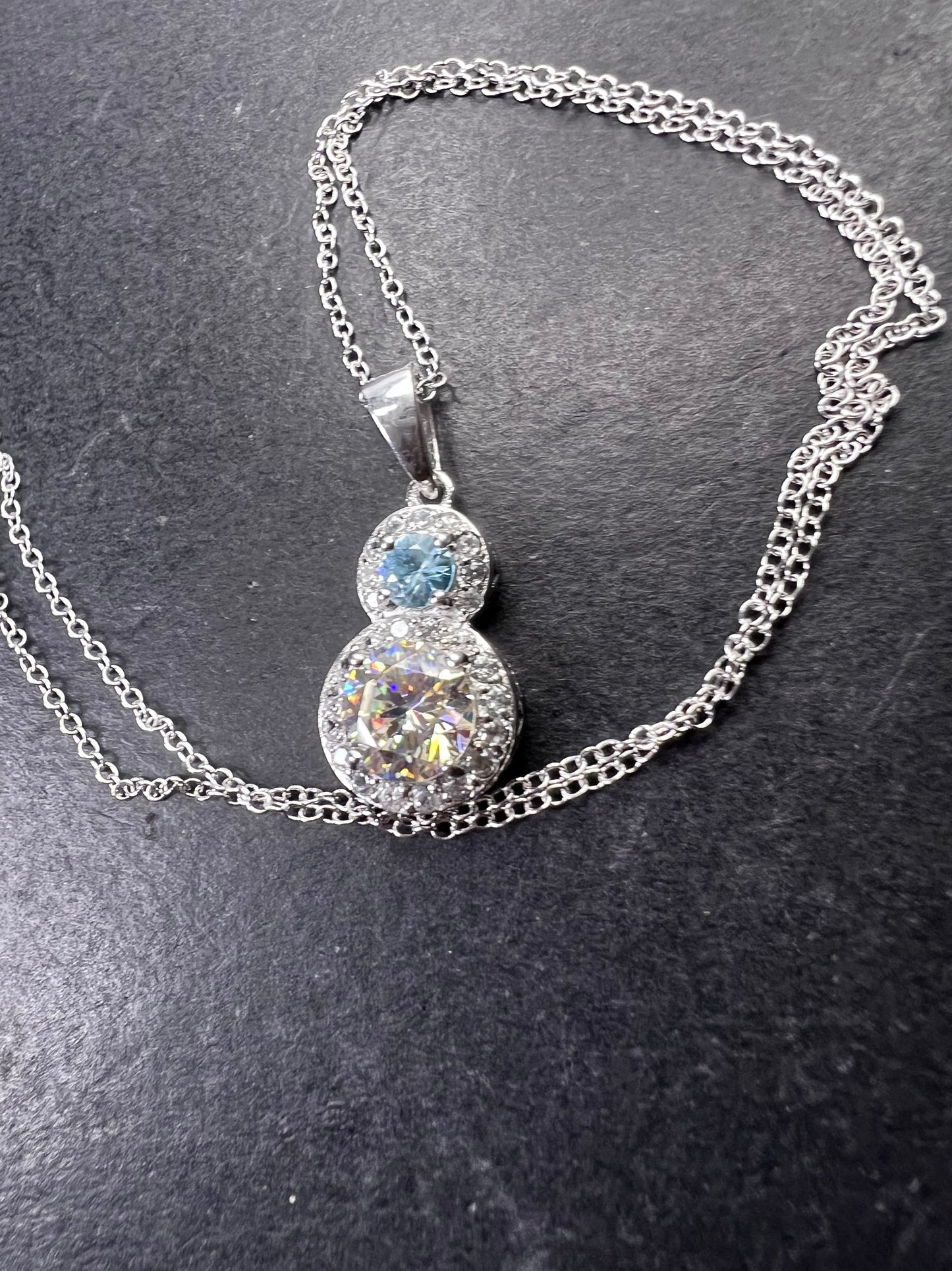 Strontium titanate and blue topaz sterling silver halo pendant with 18 inch chain necklace